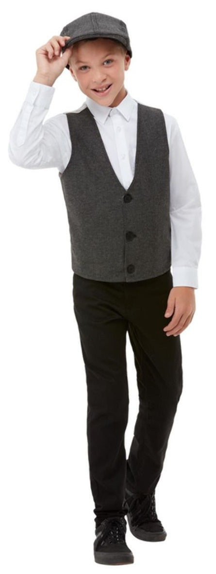 Young boy wearing a 20s Gangster Boy Kit including a grey waistcoat and a matching grey flat cap, isolated on a white background.