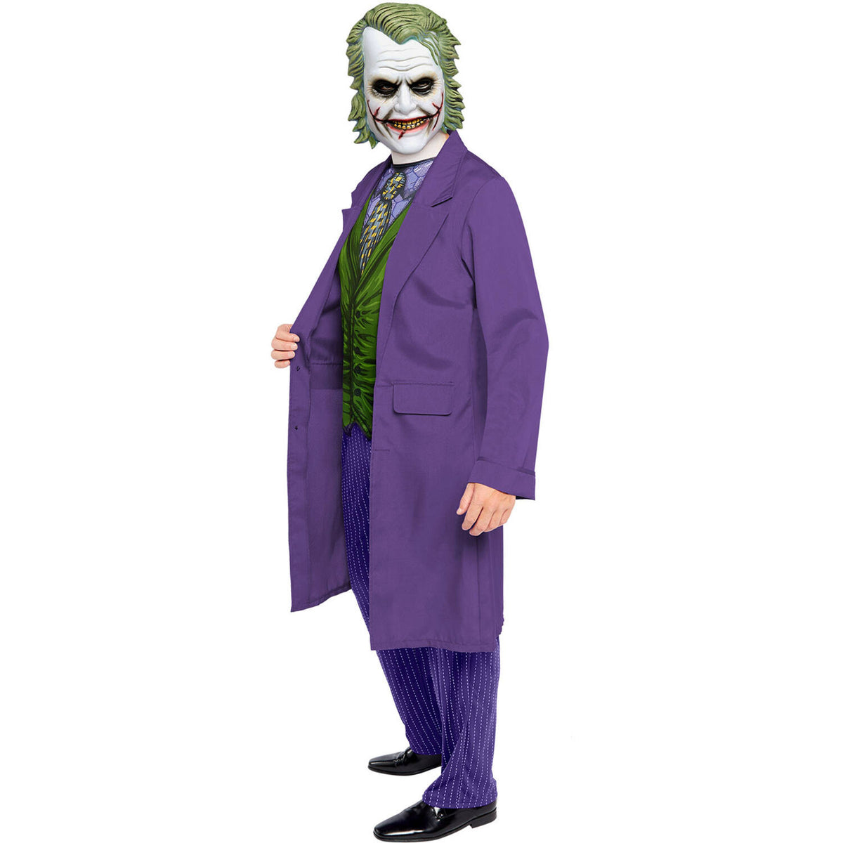 A side profile of a man wearing the Dark Knight Joker costume, showing the long purple jacket, green printed waistcoat, purple pinstripe trousers, and foam character mask.