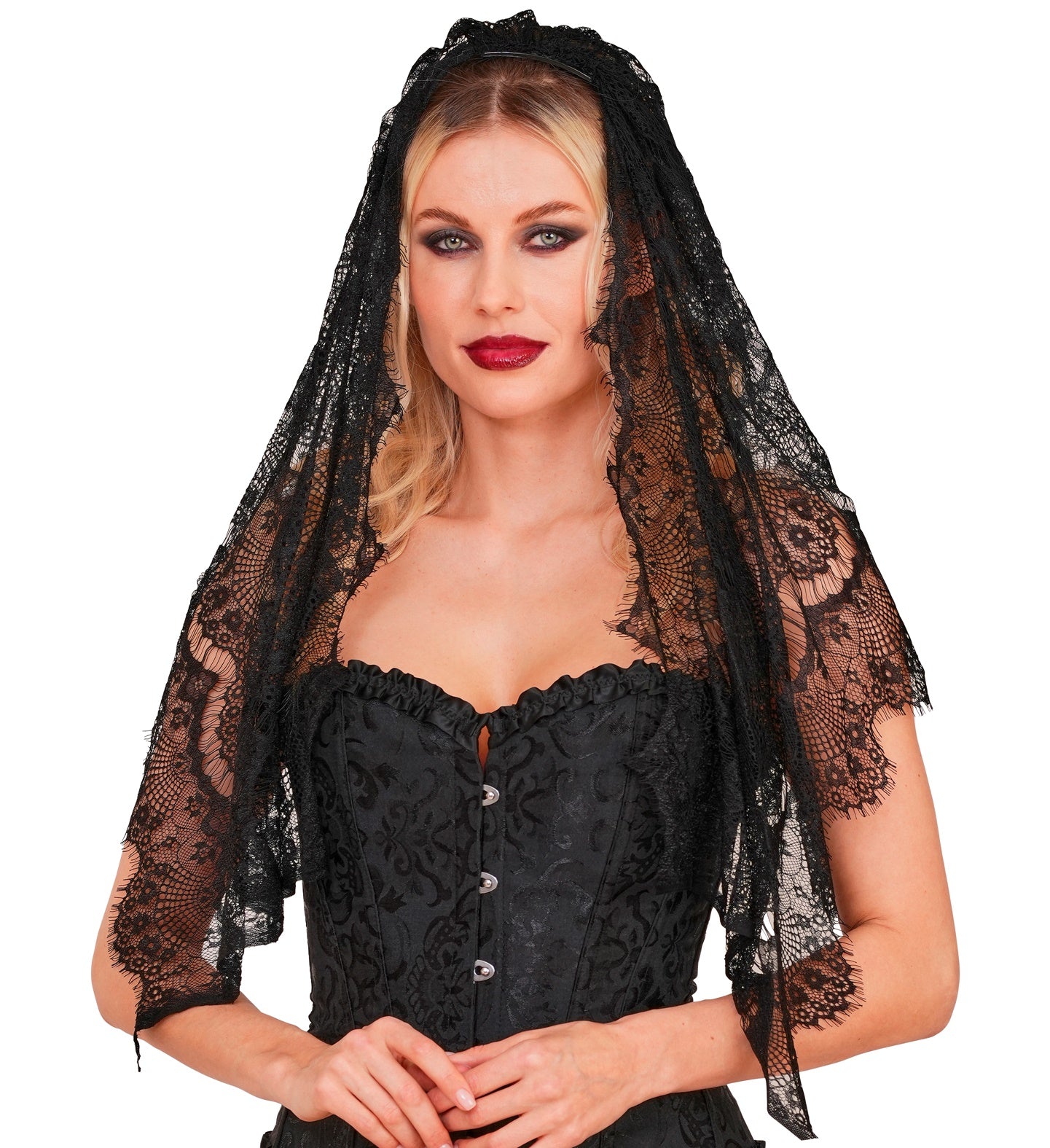 A blonde female model styled as a gothic bride wearing a long black lace veil with scalloped edges and a black corset.