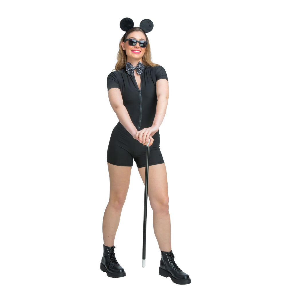 A woman smiles while wearing the Blind Mice accessory kit (ears, glasses, bowtie) and leaning on the black cane