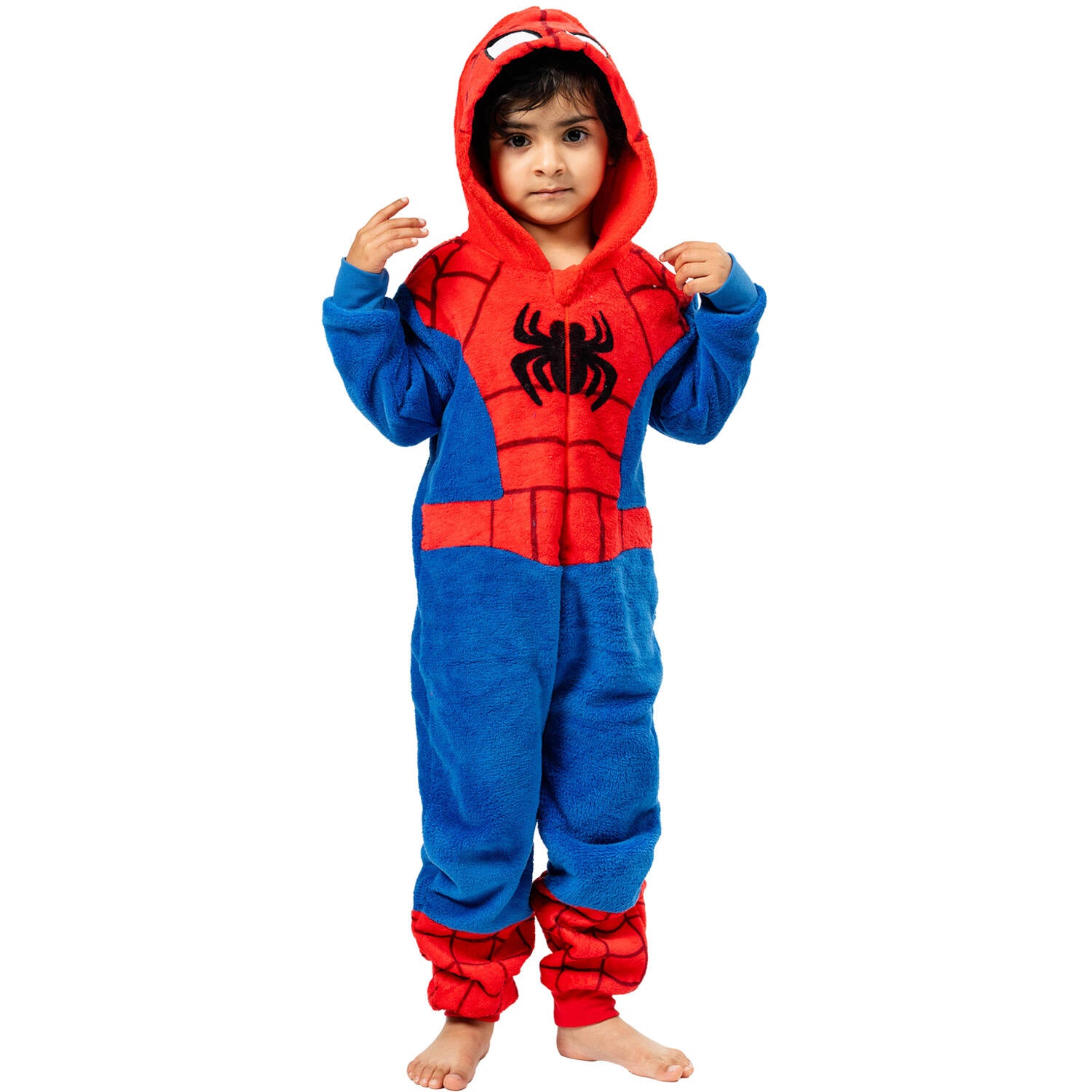 A young child standing comfortably in a cozy, blue and red Spider-Man hooded onesie featuring the classic superhero web design and a front zipper.