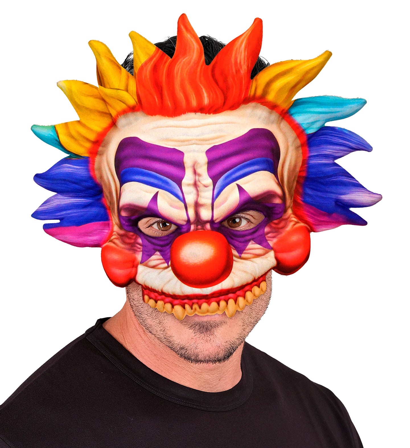 A man wearing a multi-coloured chinless killer clown mask with a black t-shirt, showing how it leaves his own mouth exposed.