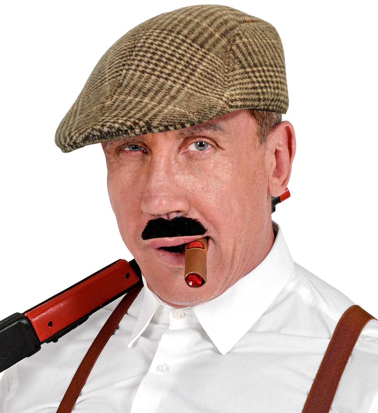 A man in a 1920s gangster costume with a fake cigar and prop gun wears a classic brown houndstooth flat cap.