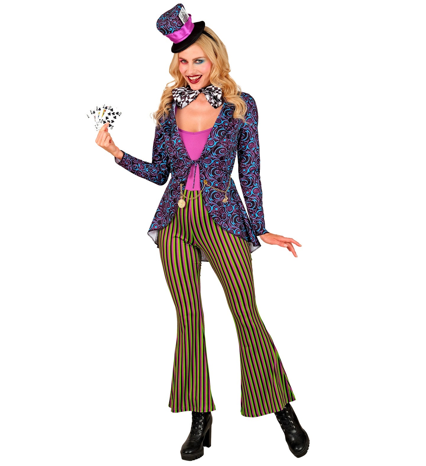 A model wearing a psychedelic Mad Hatter costume with striped flared trousers and a purple swirl jacket, smiling playfully while fanning out a hand of playing cards.