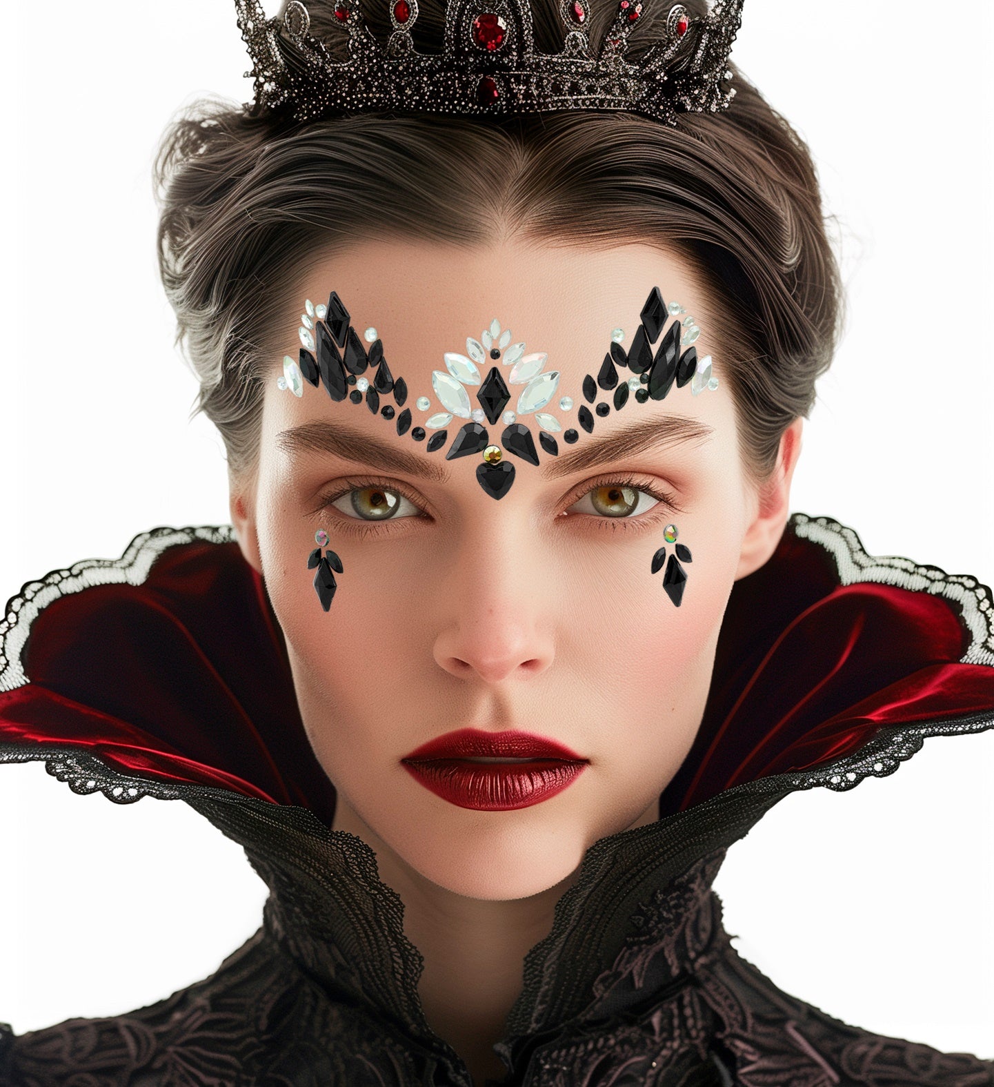 A person wearing a dark crown, red velvet collar, and intricate black and iridescent forehead face jewels.