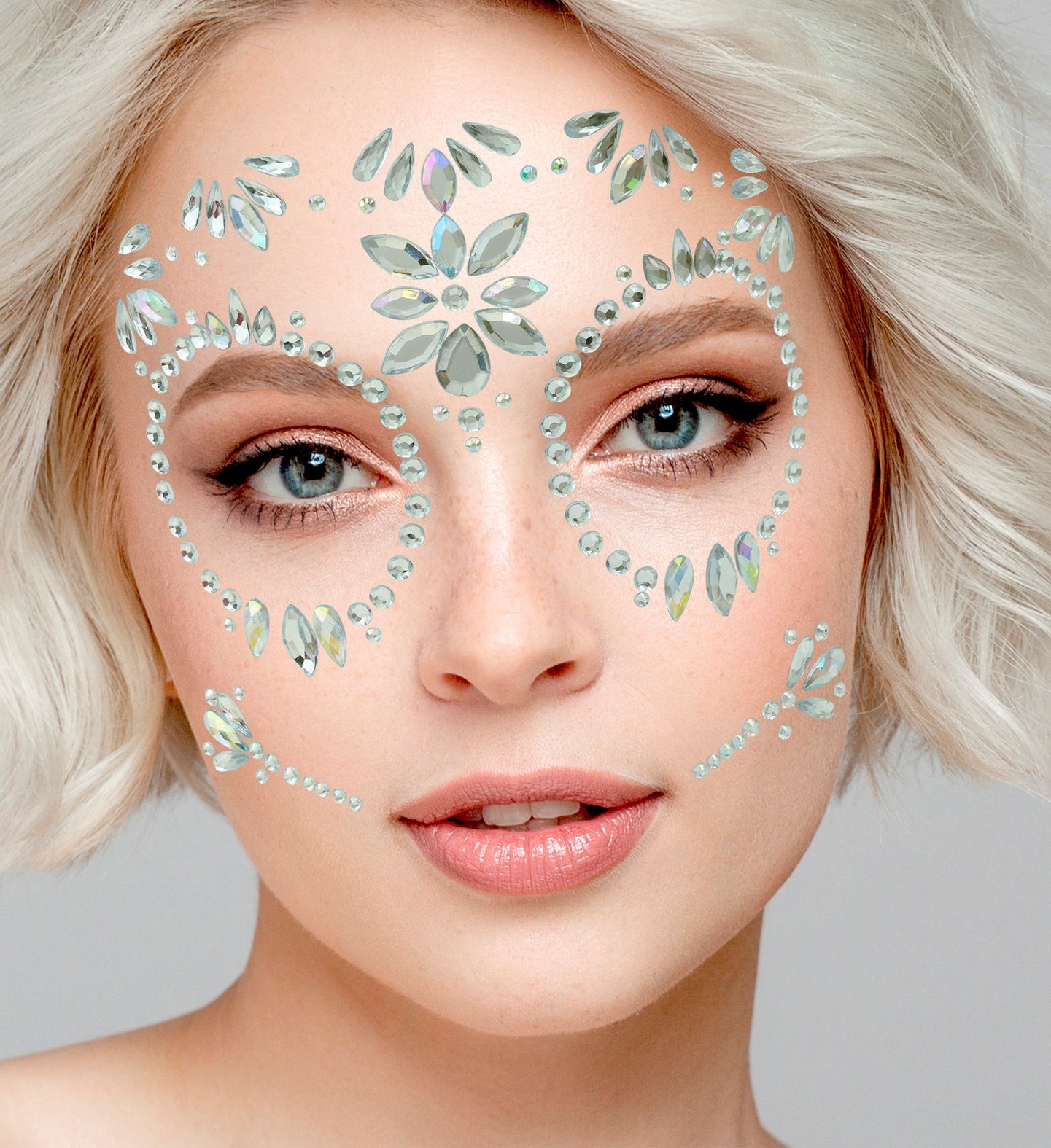 Close-up of a symmetrical iridescent gem arrangement framing the eyes and forehead for a Day of the Dead costume.