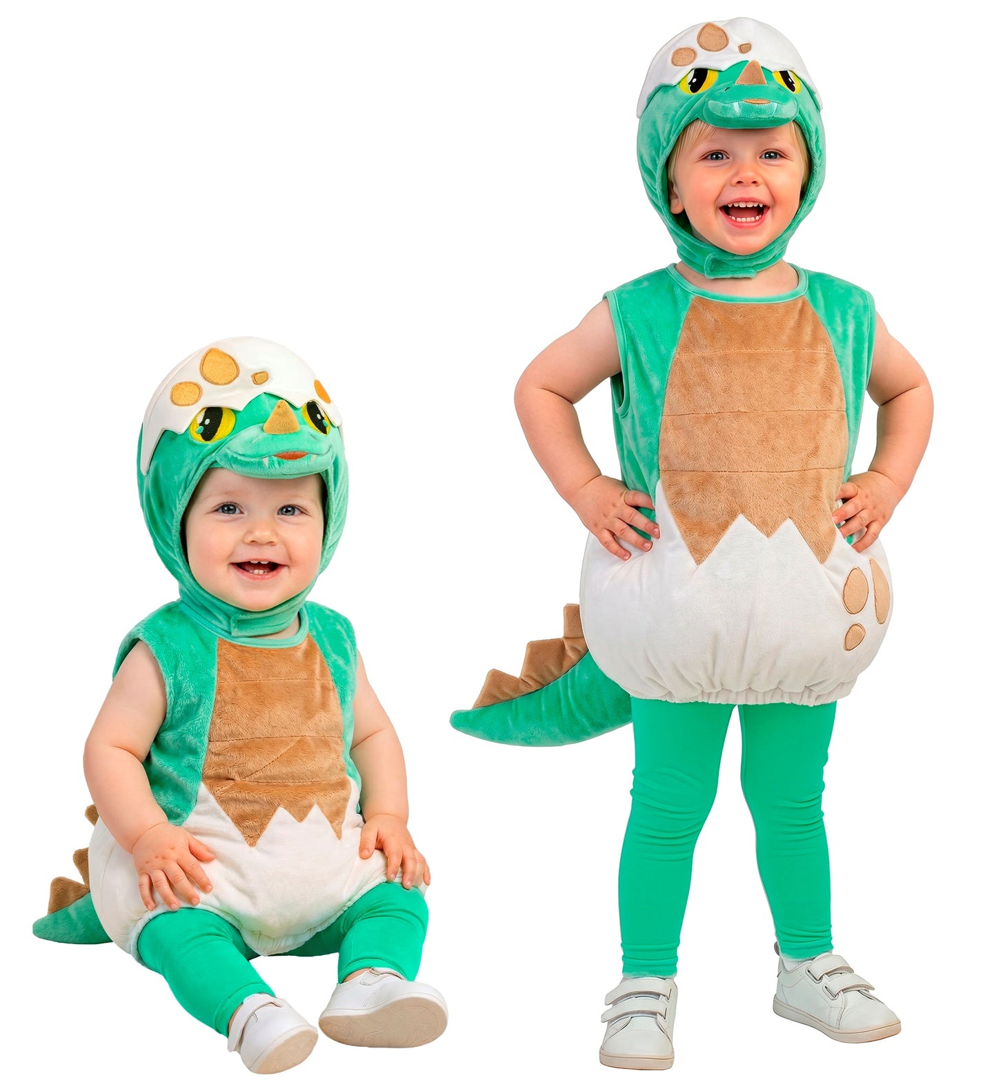Two young children modelling the green baby dinosaur costume side-by-side, showcasing one child sitting comfortably and the other standing to show the complete outfit with pants.