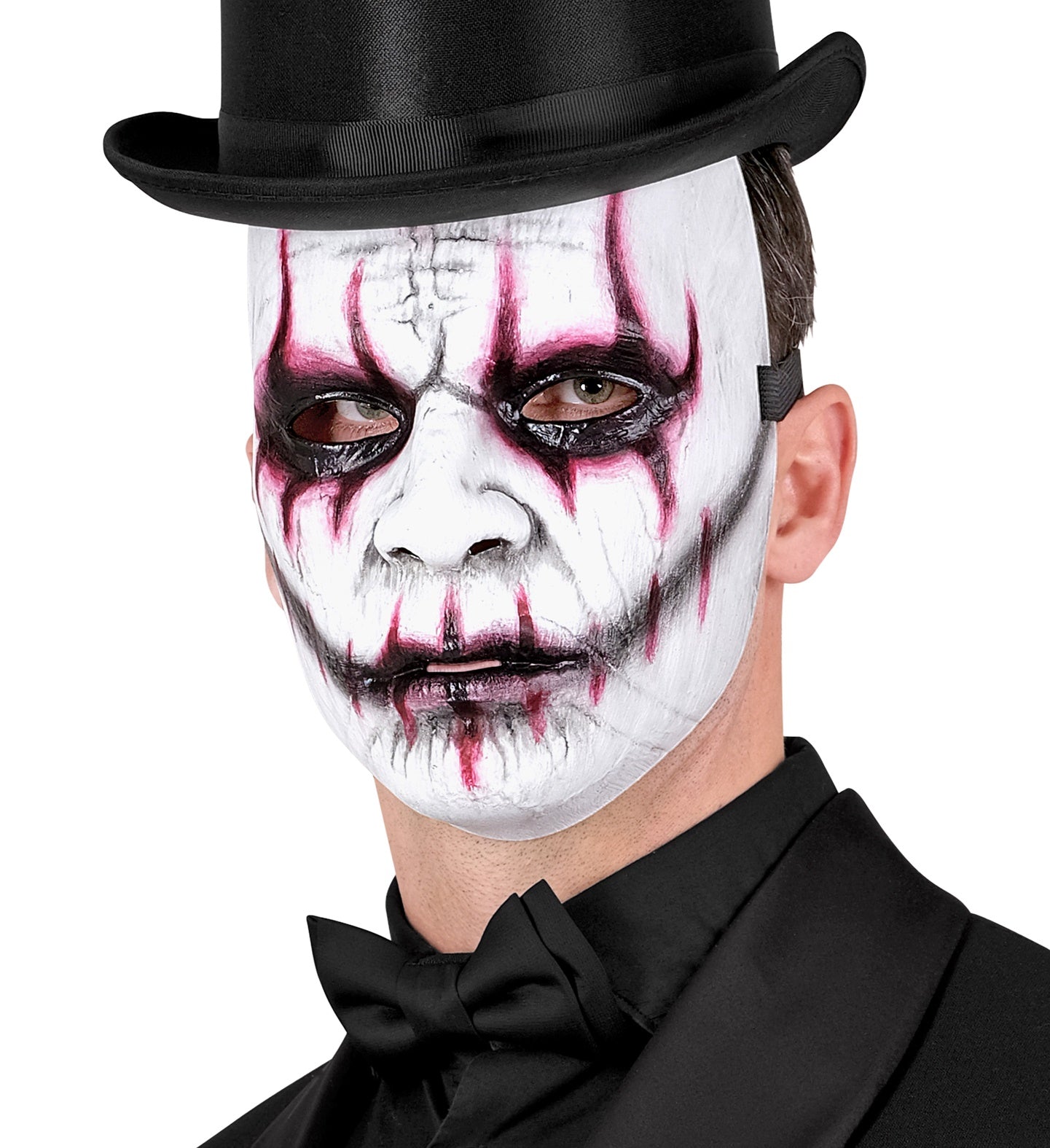 A man wearing a creepy white joker mask with bloody markings, paired with a formal black top hat and bow tie.