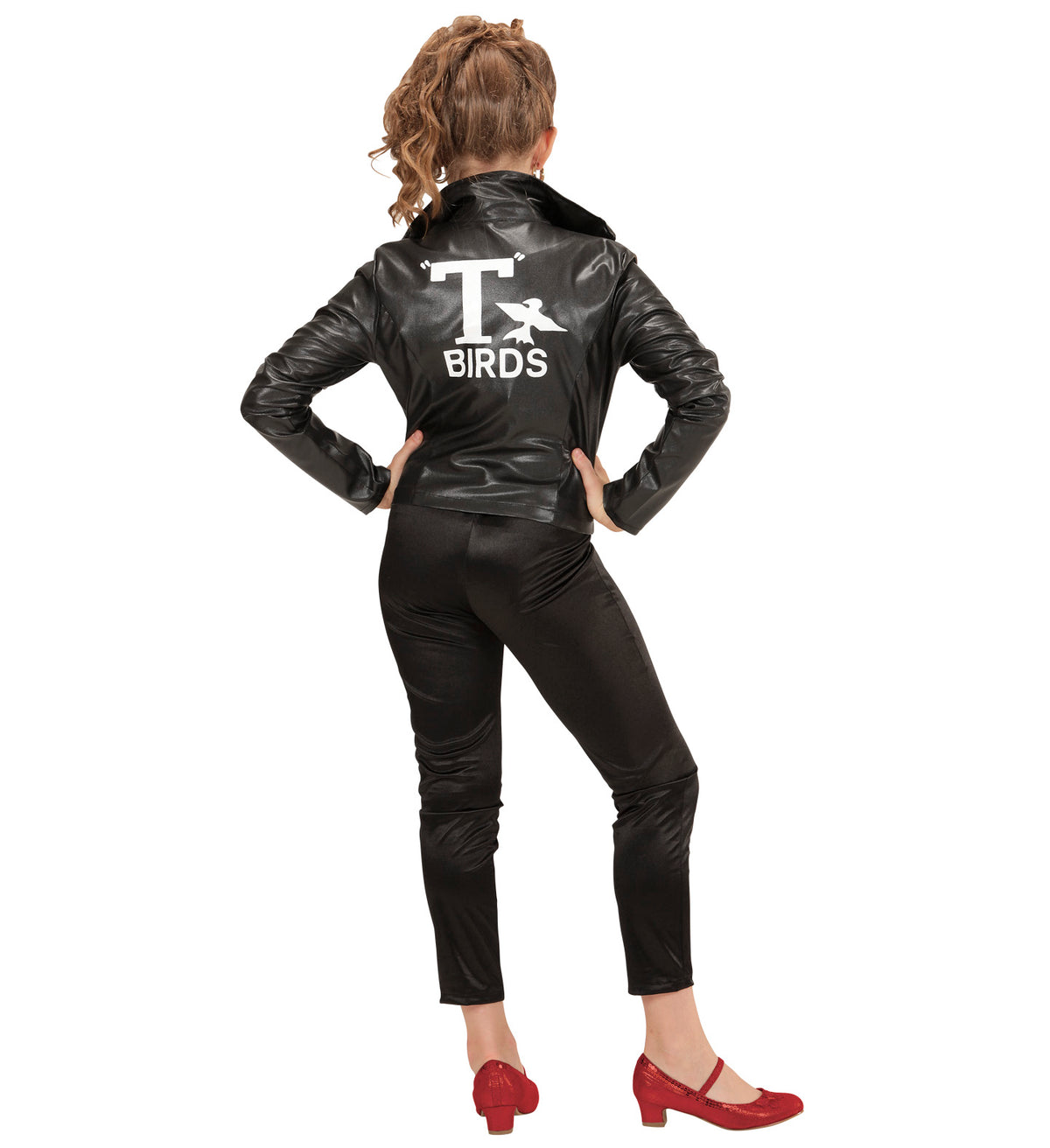A woman modeling a black faux-leather costume jacket and matching pants from the back, featuring a white 'T BIRDS' graphic with a bird silhouette on the back, paired with red shoes against a white background.