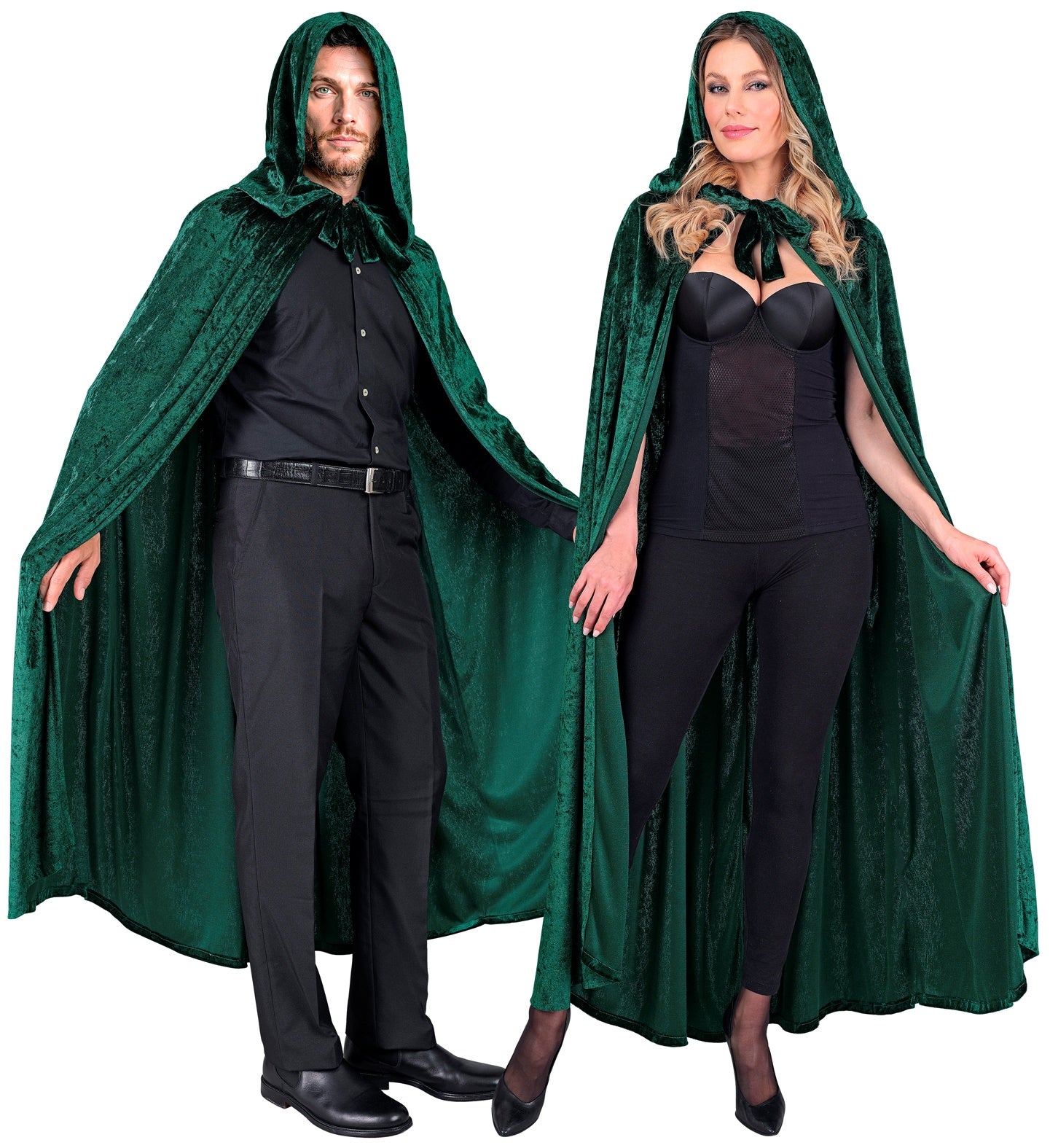 A man and a woman in modern black clothing model the unisex green velvet hooded cape.