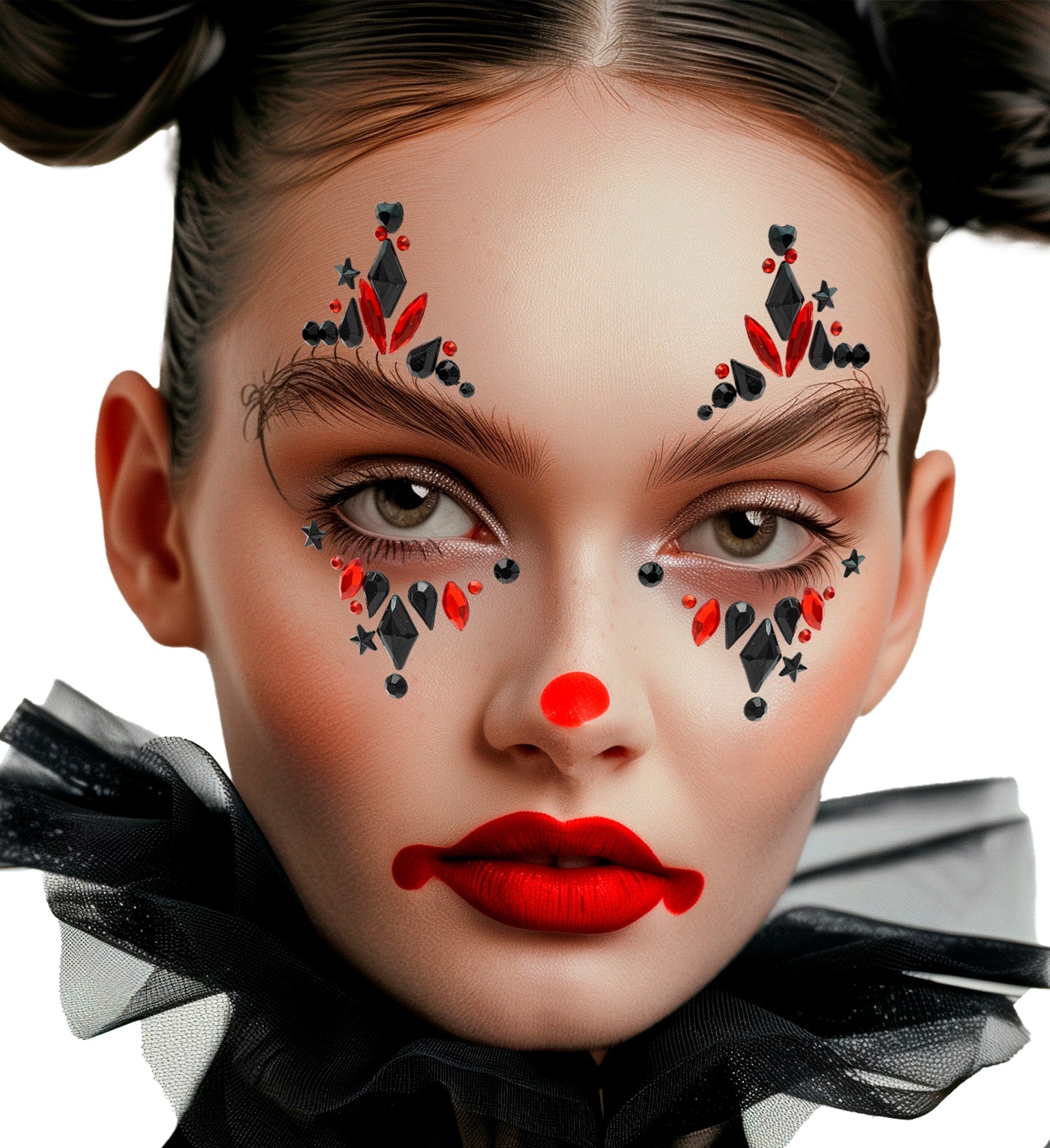 A woman wearing dramatic harlequin clown makeup and red and black face jewels with star and diamond accents.