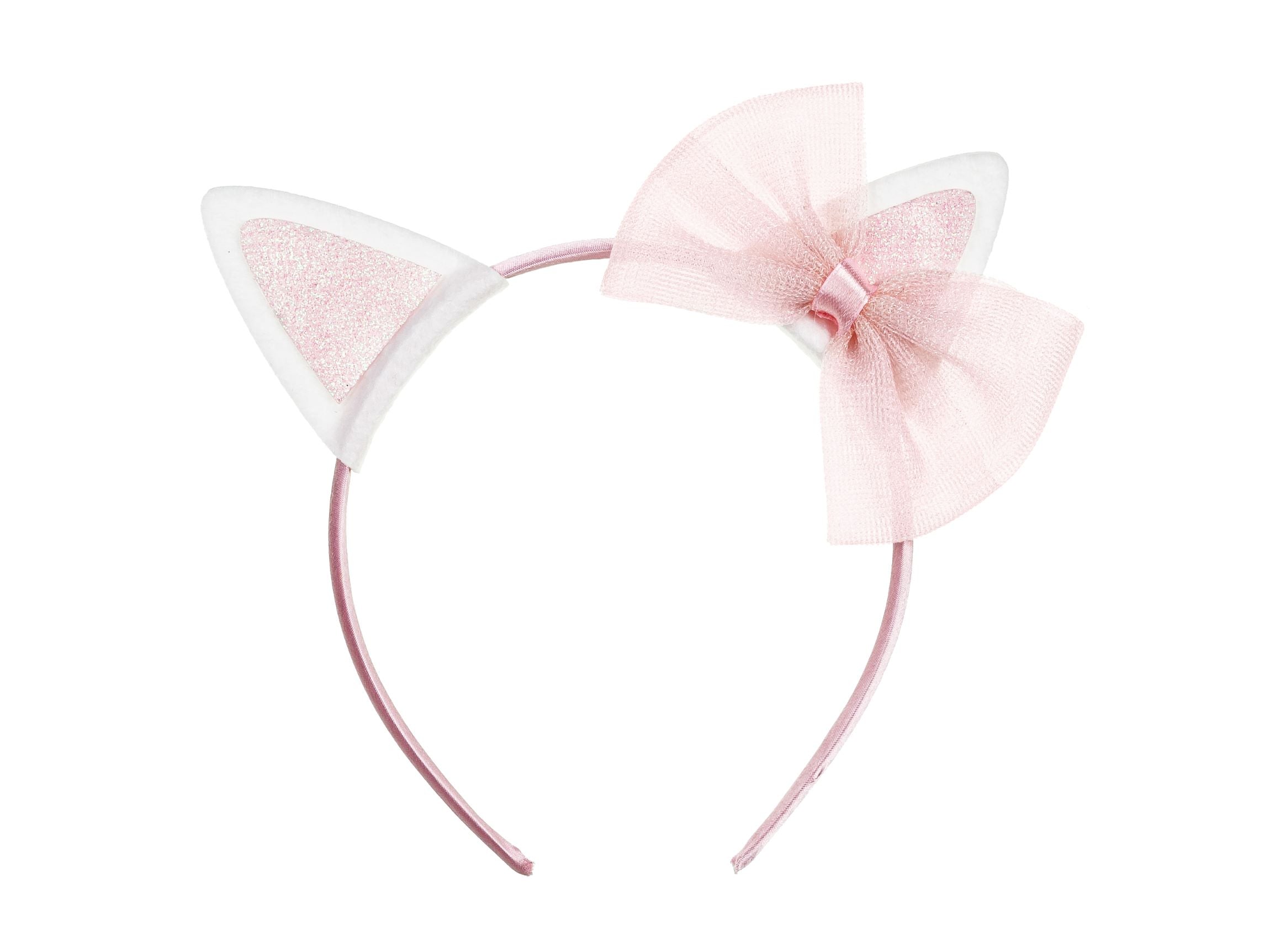 A pink children's headband with two white cat ears that have a glittery pink interior and a pink organza bow attached to the side, isolated on a white background.