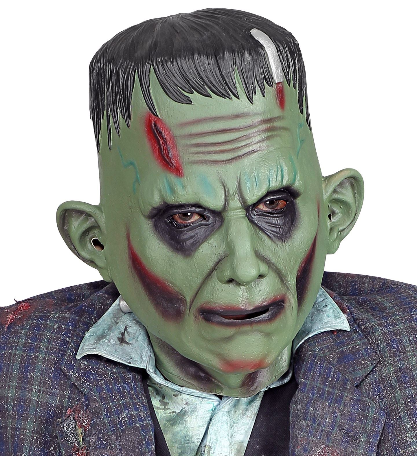 A close-up portrait of a person wearing a green full-head Frankenstein monster mask with dark sunken eyes, red forehead scars, and neck bolts, styled with a distressed tweed suit jacket and messy shirt.