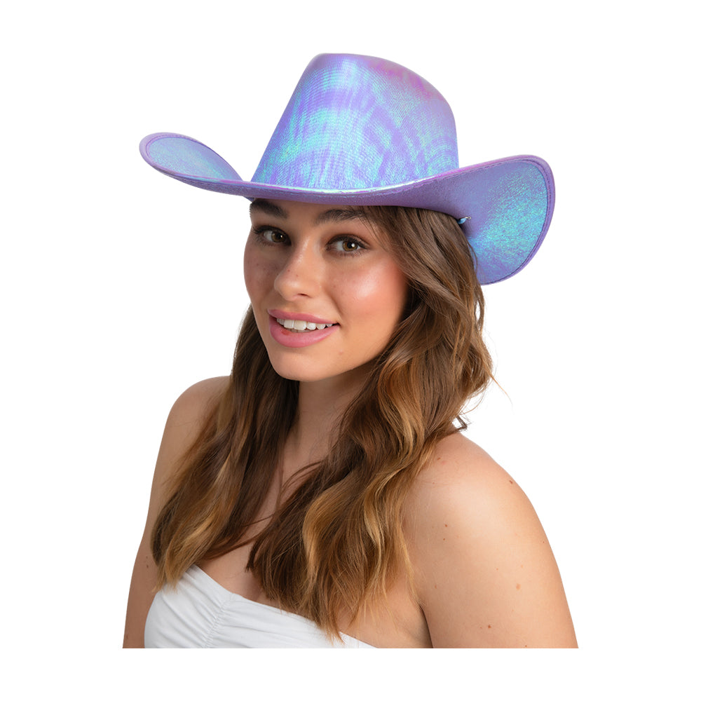 Woman smiling while wearing a sparkly lavender iridescent ladies Texan cowboy hat, with long brown hair.