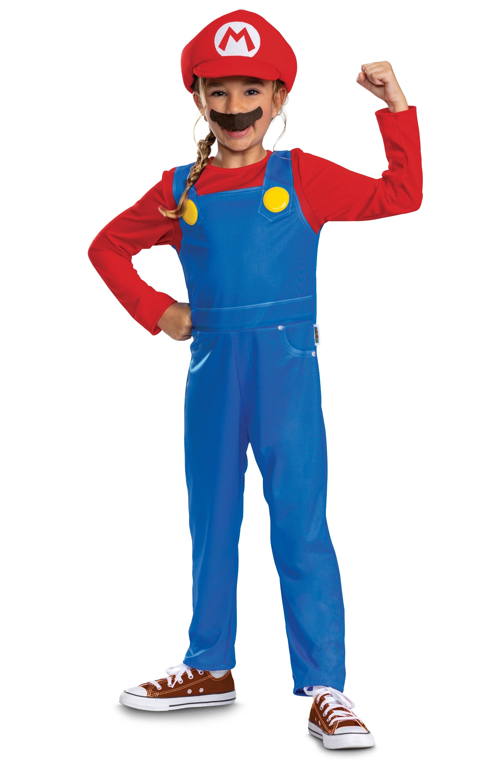 A girl wearing an officially licensed Super Mario fancy dress costume featuring a red and blue one-piece jumpsuit, red 'M' hat, and a faux moustache, posing playfully with a flexed arm.