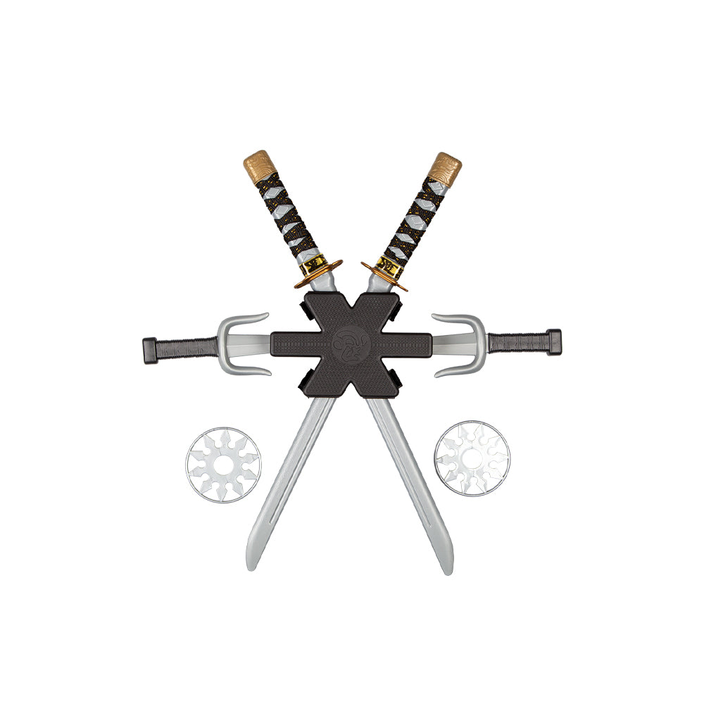 A child's plastic ninja costume weapon set featuring a black central backpack piece holding two crossed swords, flanked by two silver daggers and two silver throwing stars