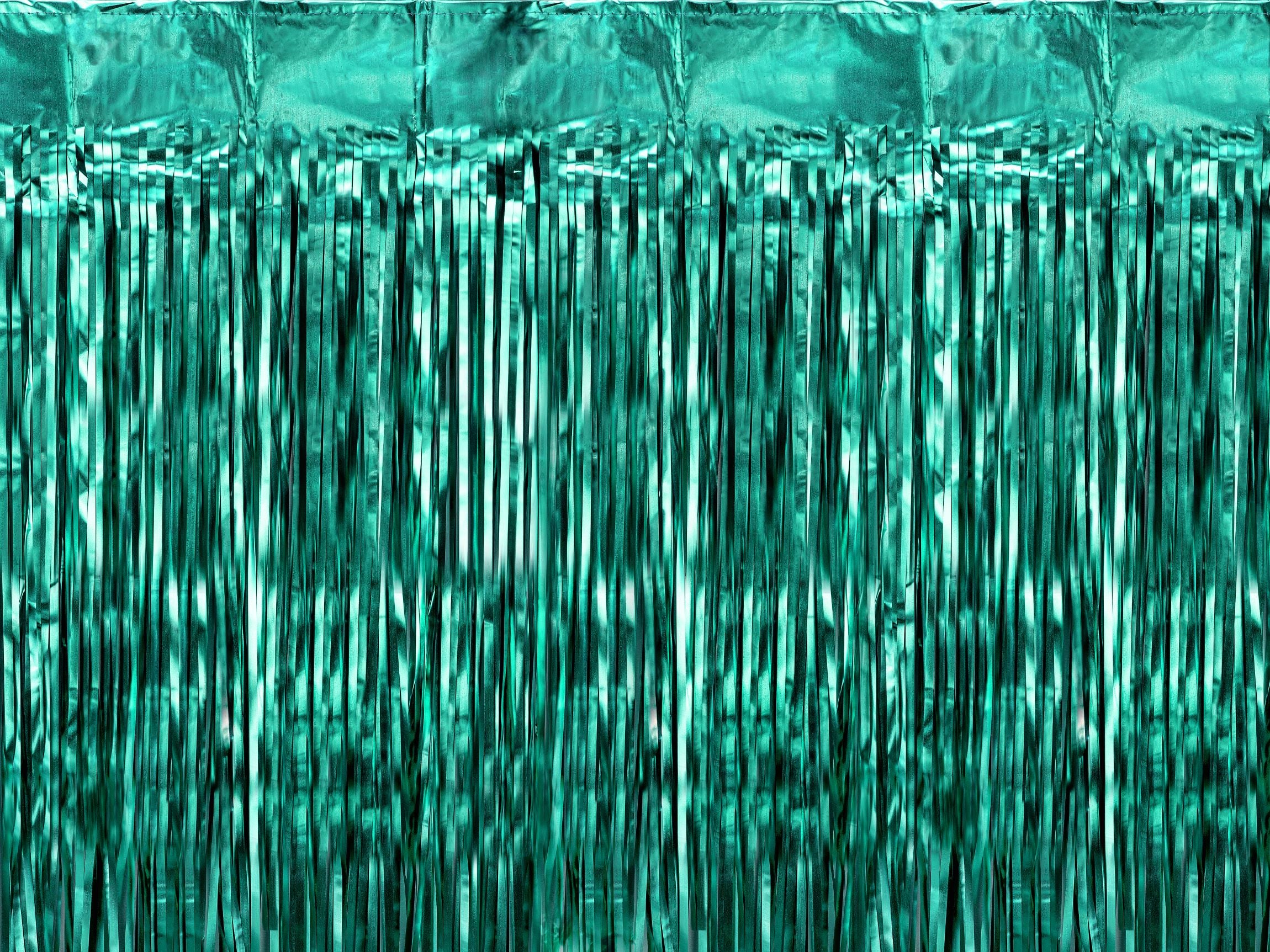 A shimmering bottle green foil fringe curtain, perfect as a party backdrop or door decoration.