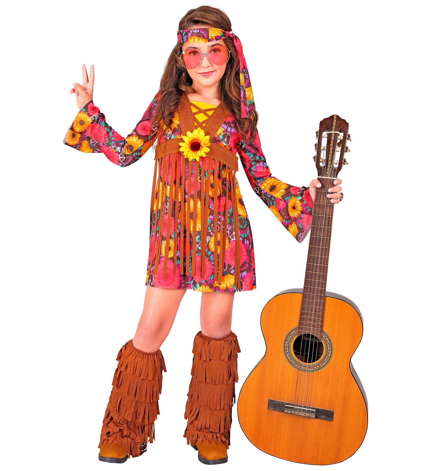 Girl modeling a Peace Flower Hippie costume with a floral dress, fringe vest, and matching boot covers, holding a guitar.