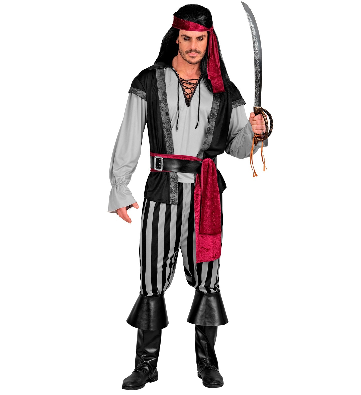 A man dressed in a pirate rogue costume, posing front-on with a cutlass raised. The costume includes a grey shirt with a black vest, black and grey striped pants, a red sash, a black belt, a red headband, and black boot covers. He has a dark wig with dreadlocks and beads.