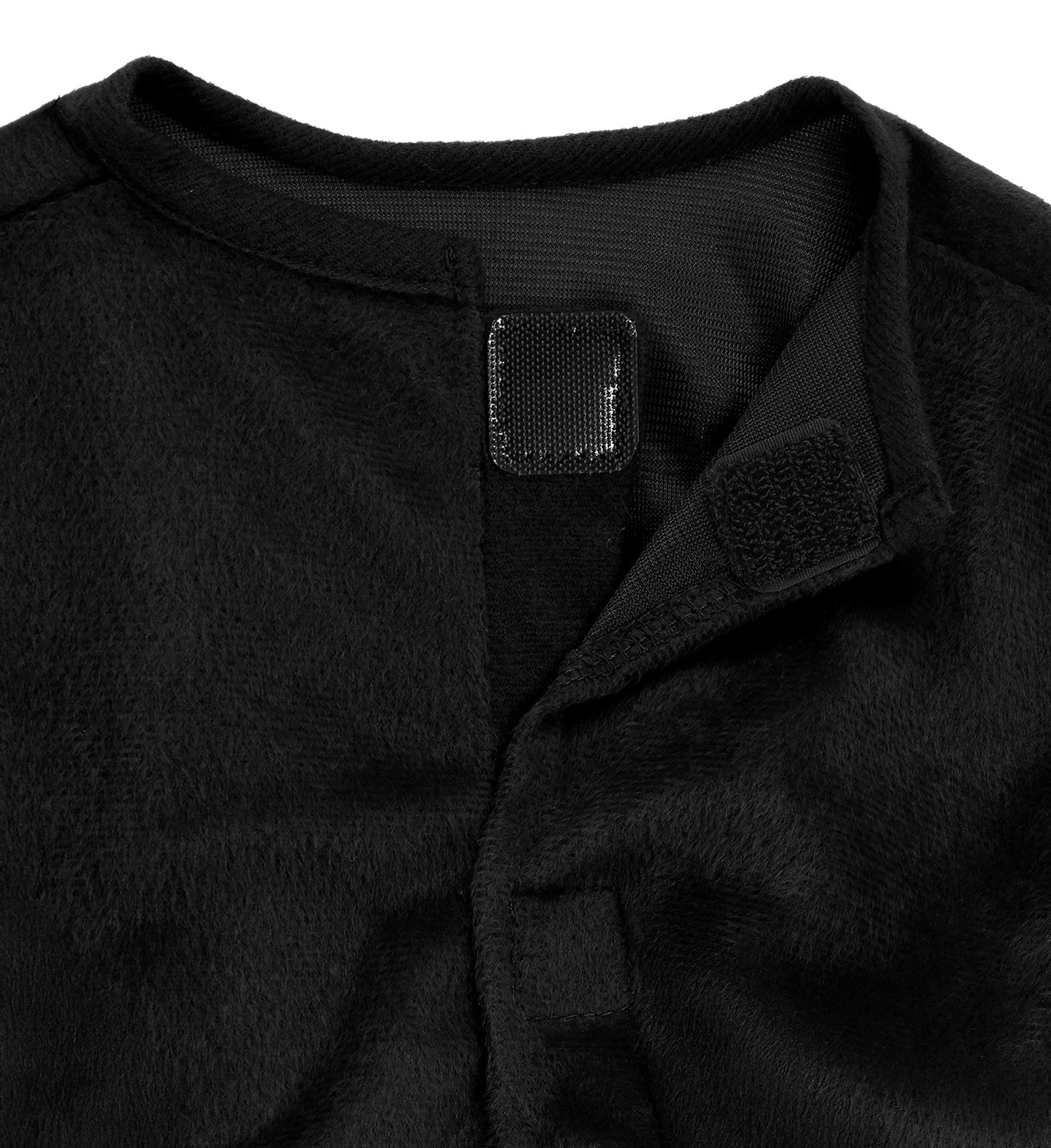 A close-up of the neck area of the black plush jumpsuit, showing the black velcro closure at the back.