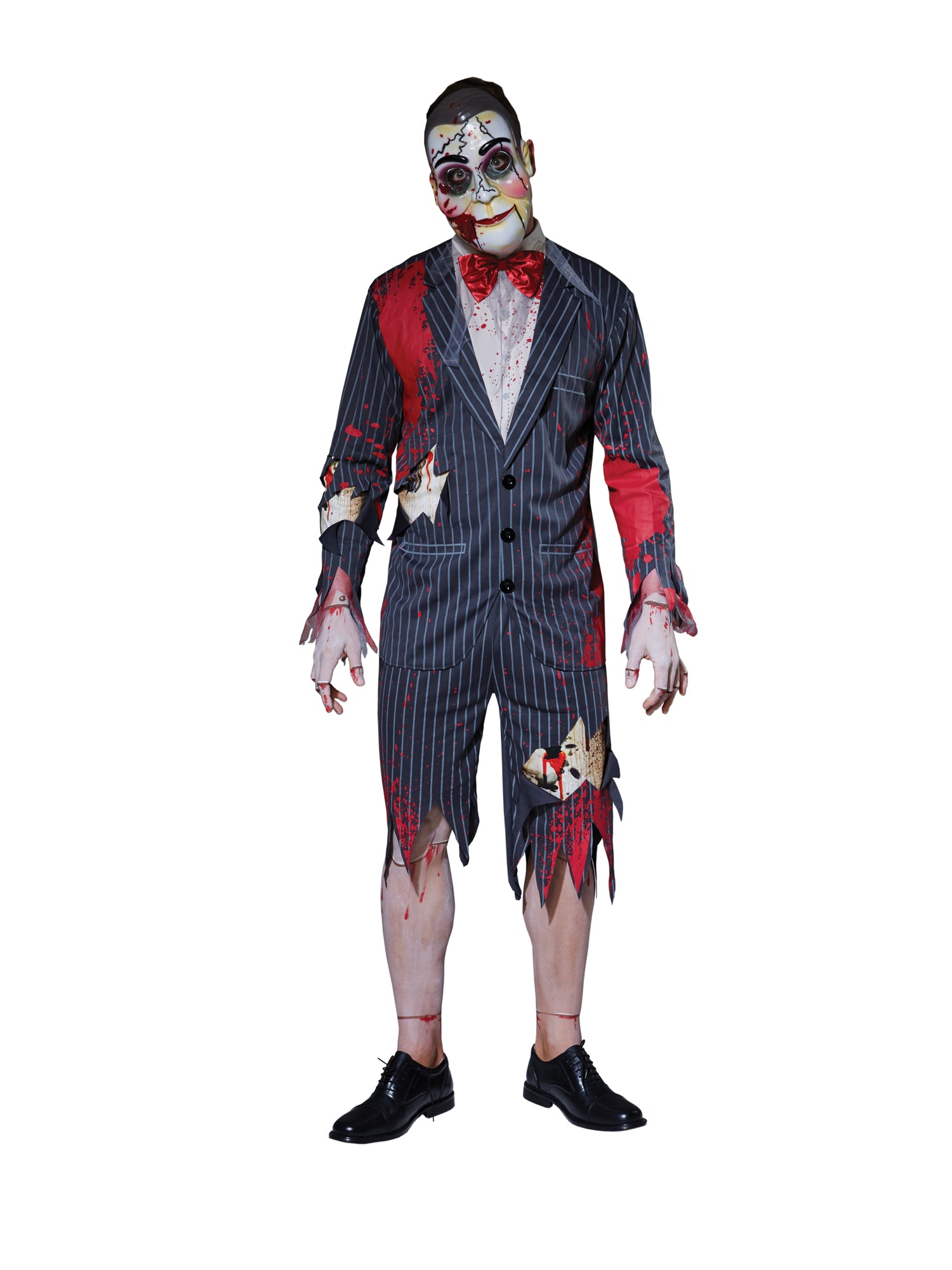 Man wearing a detailed zombie puppet costume with a suit and face paint on a white background