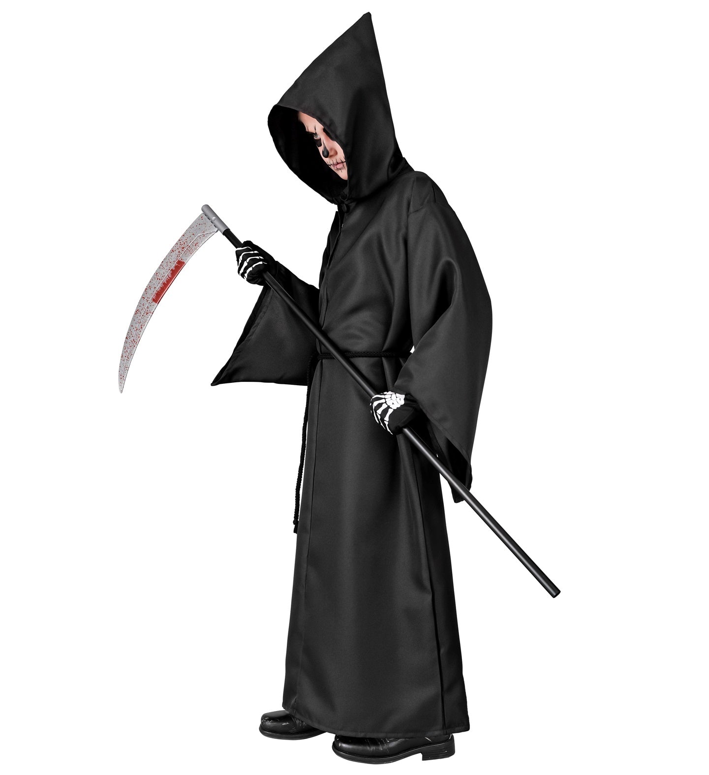 Side view of a child in a classic Grim Reaper costume, looking down at a prop scythe.
