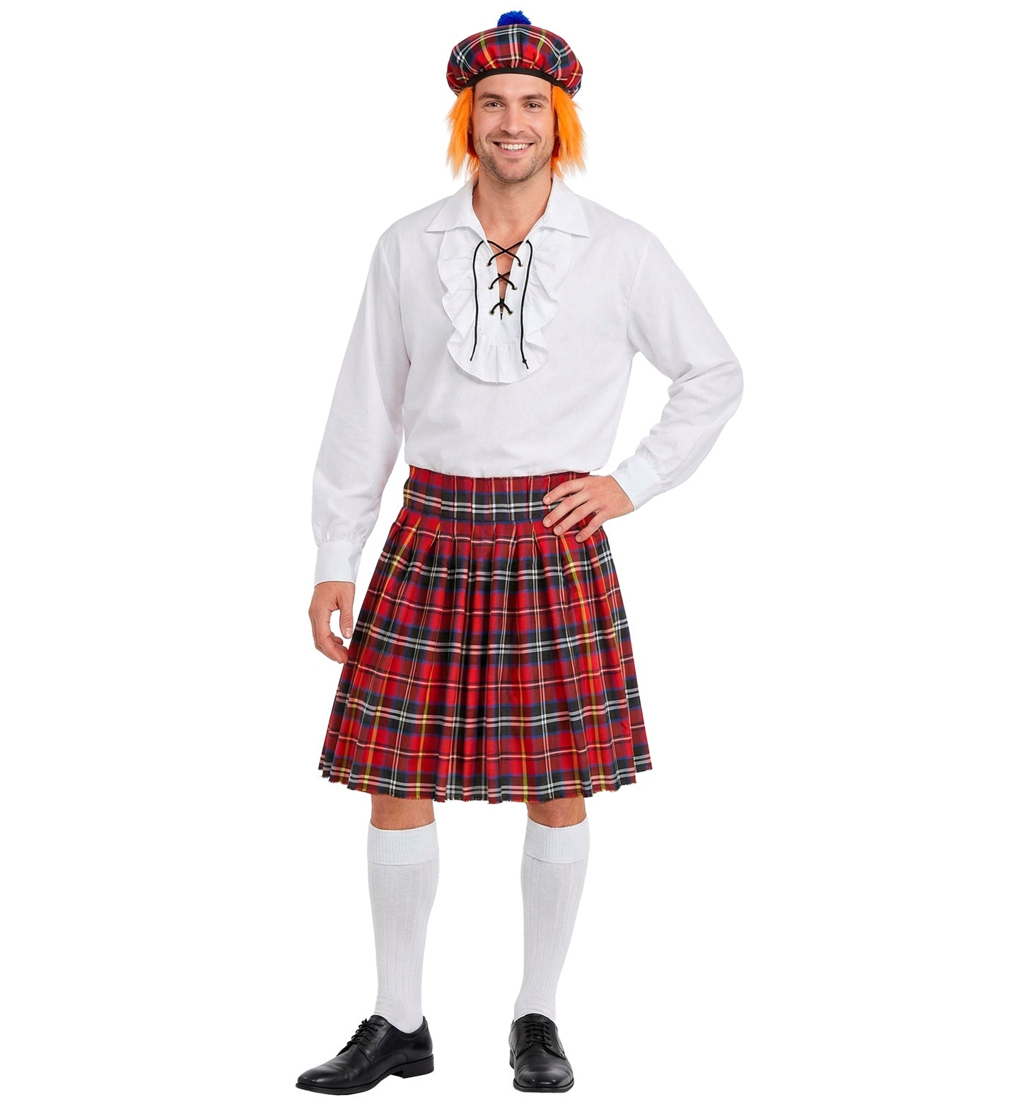 A man modeling a Scottish kilt costume against a plain white background. The costume includes a red, green, and black tartan kilt, a matching plaid bonnet with a blue top, a white long-sleeve shirt with lace-up front, white knee-high socks, and black dress shoes.
