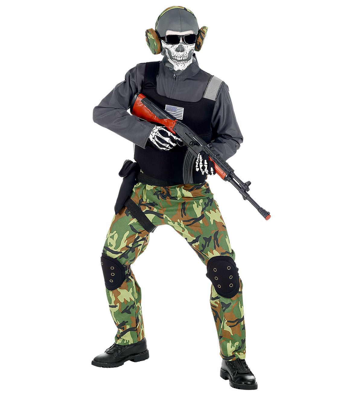 A child dressed in a skeleton soldier costume with camo trousers, a black tactical vest, and a skull mask, holding a toy rifle.