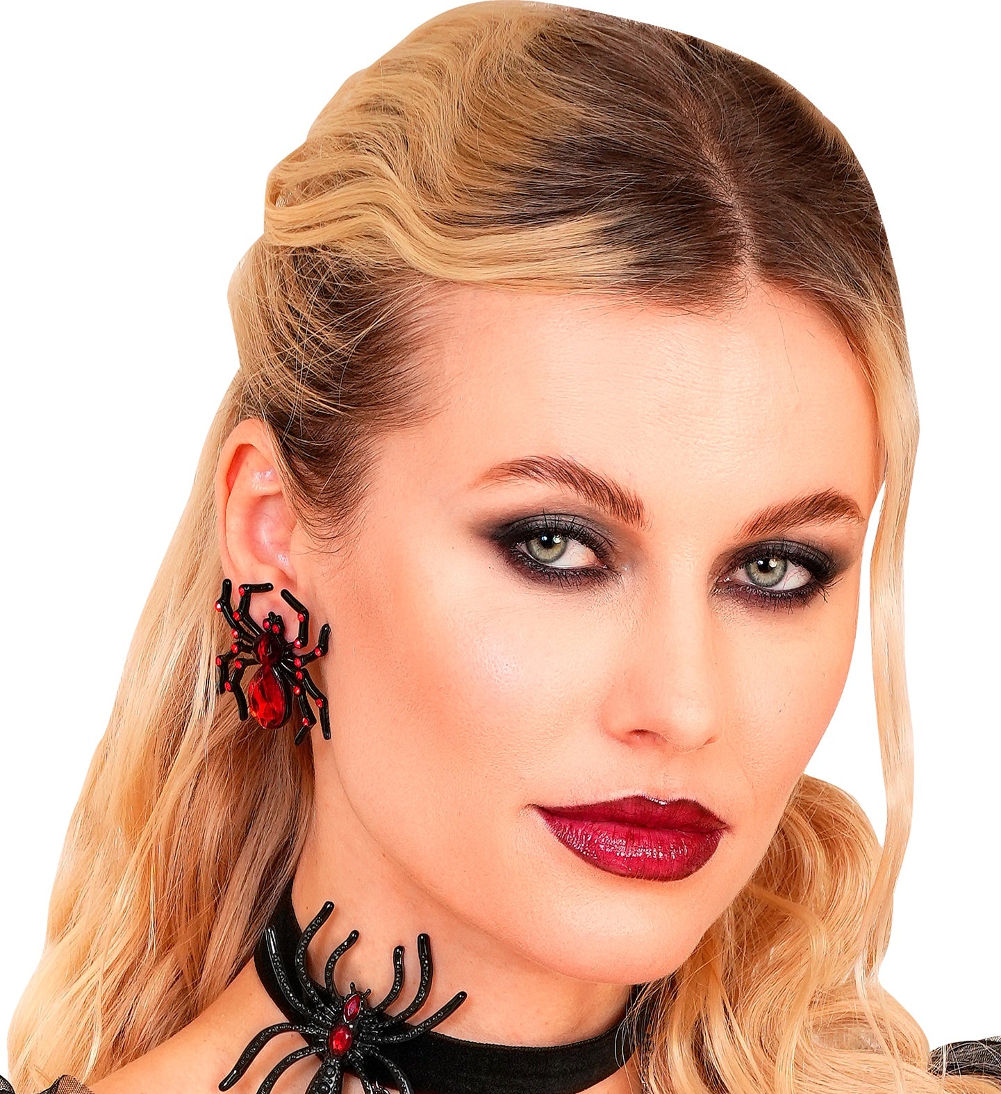 A close-up of a woman with smoky eye makeup wearing a large, sparkling red and black spider stud earring and a matching spider choker.