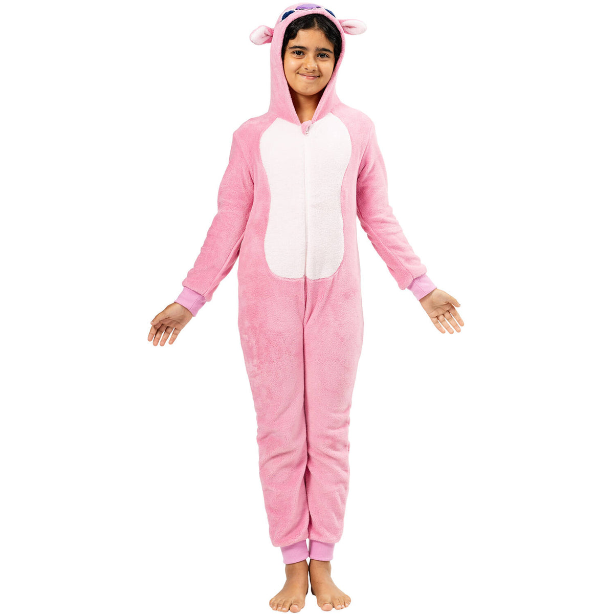 A young girl standing with her arms slightly out, wearing a pink long-sleeved onesie with a white belly and an alien character hood.