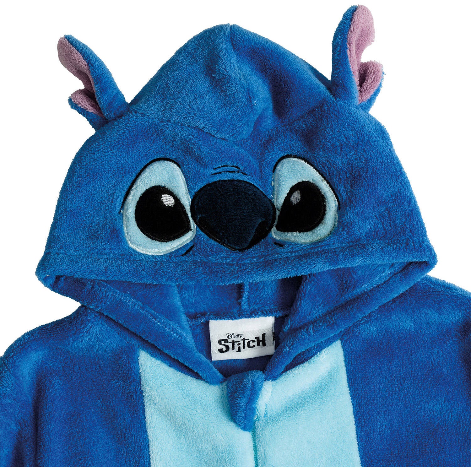 A close-up shot focusing on the hood of a blue children's Stitch onesie costume, showcasing the embroidered big black eyes, soft dark blue nose, and 3D plush ears with pink lining.