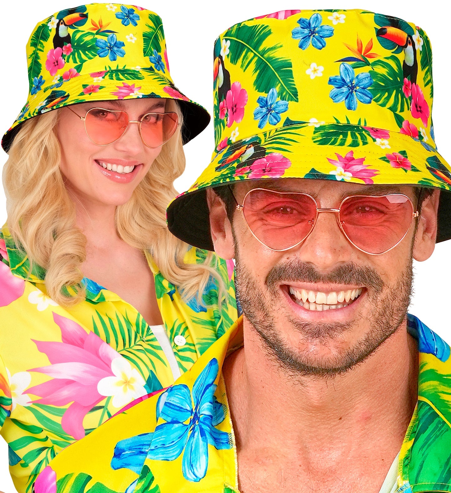 Two people wearing neon yellow tropical bucket hats with toucan and palm leaf prints, styled with pink heart-shaped sunglasses and a matching Hawaiian shirt.