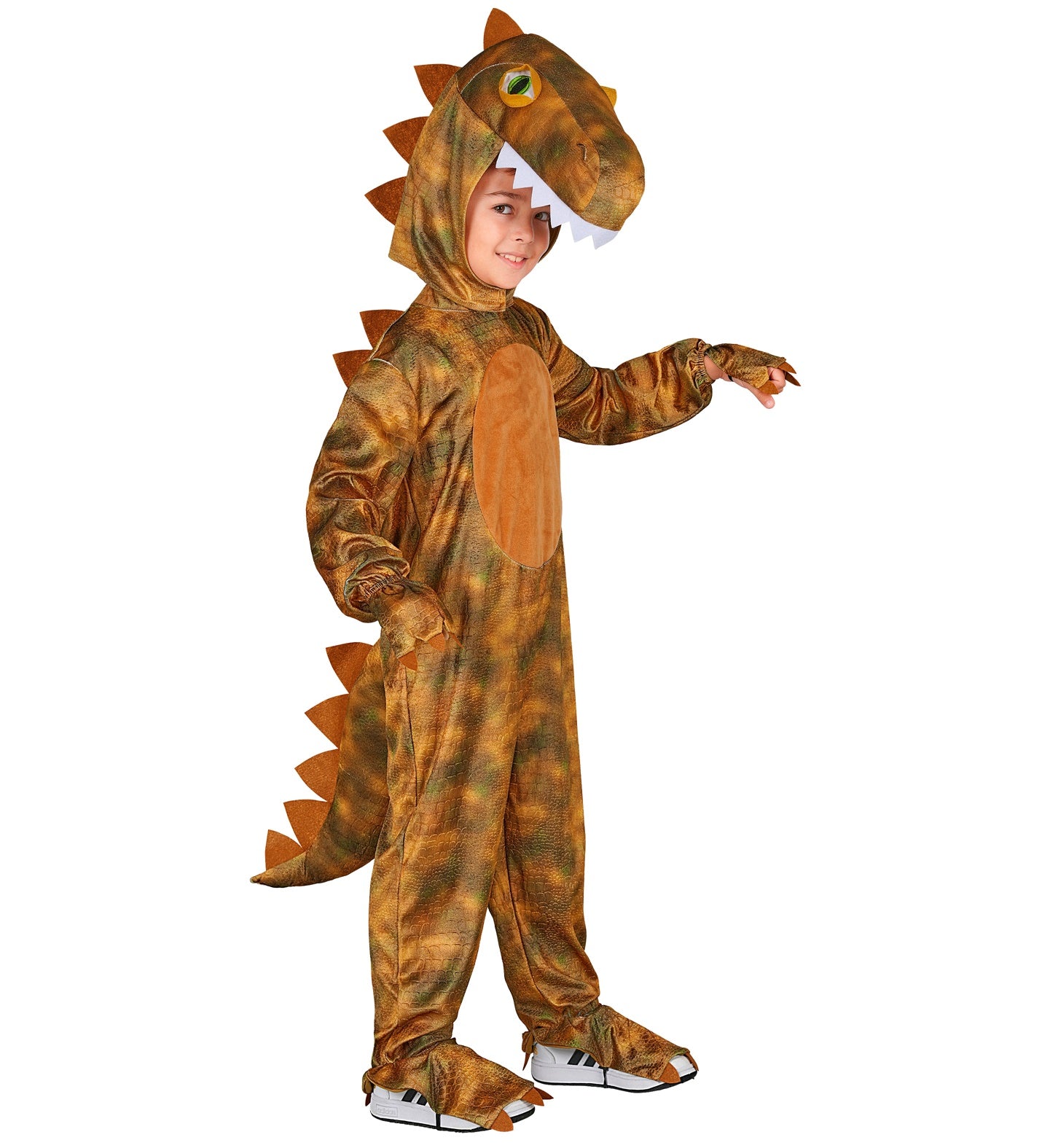 A side-profile view of a child wearing a T-Rex dinosaur fancy dress costume, showcasing the attached spiked tail, dinosaur headpiece, and elasticated shoe covers over sneakers.