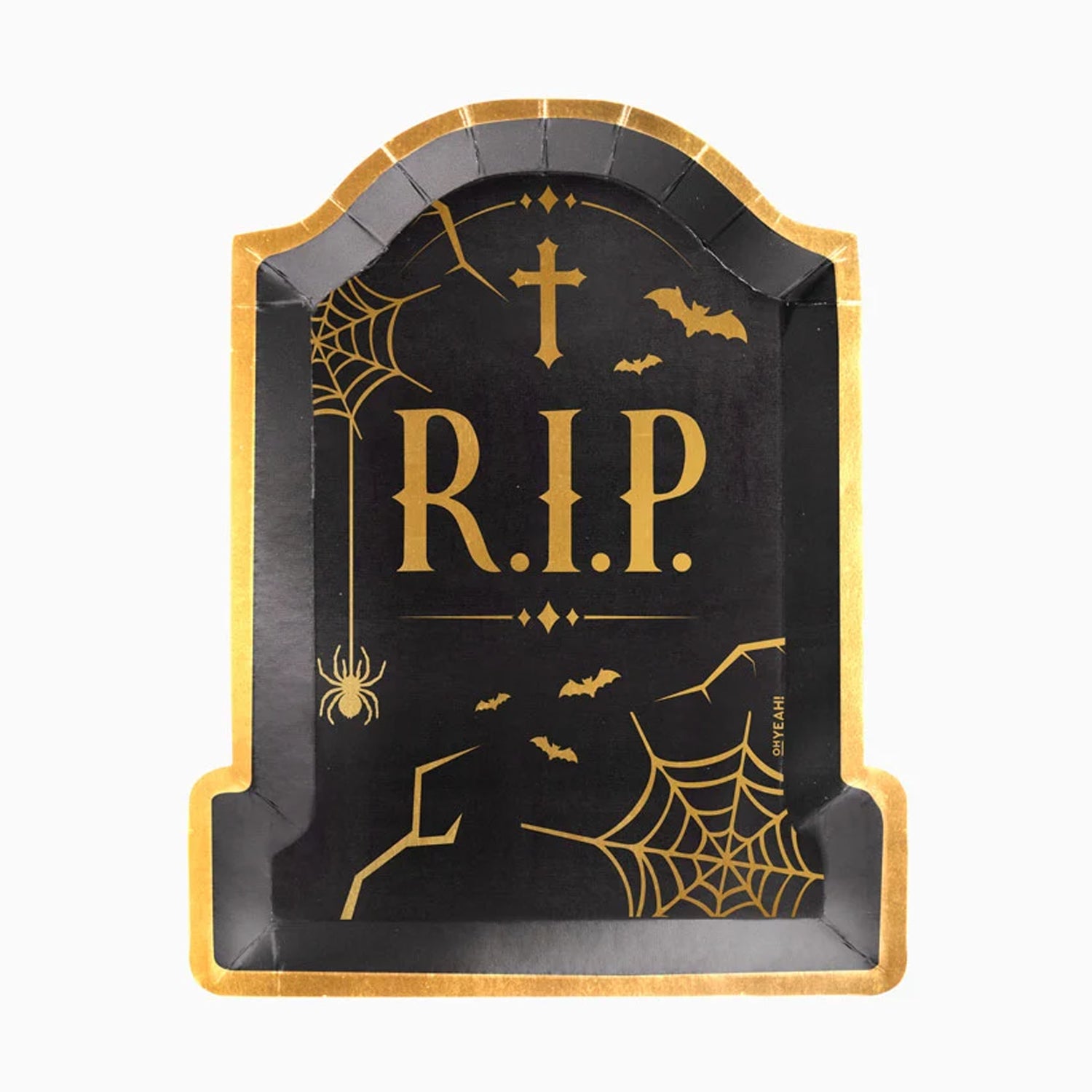 A black and gold tombstone-shaped serving tray holding Halloween cupcakes and cookies on a striped party table setting.
