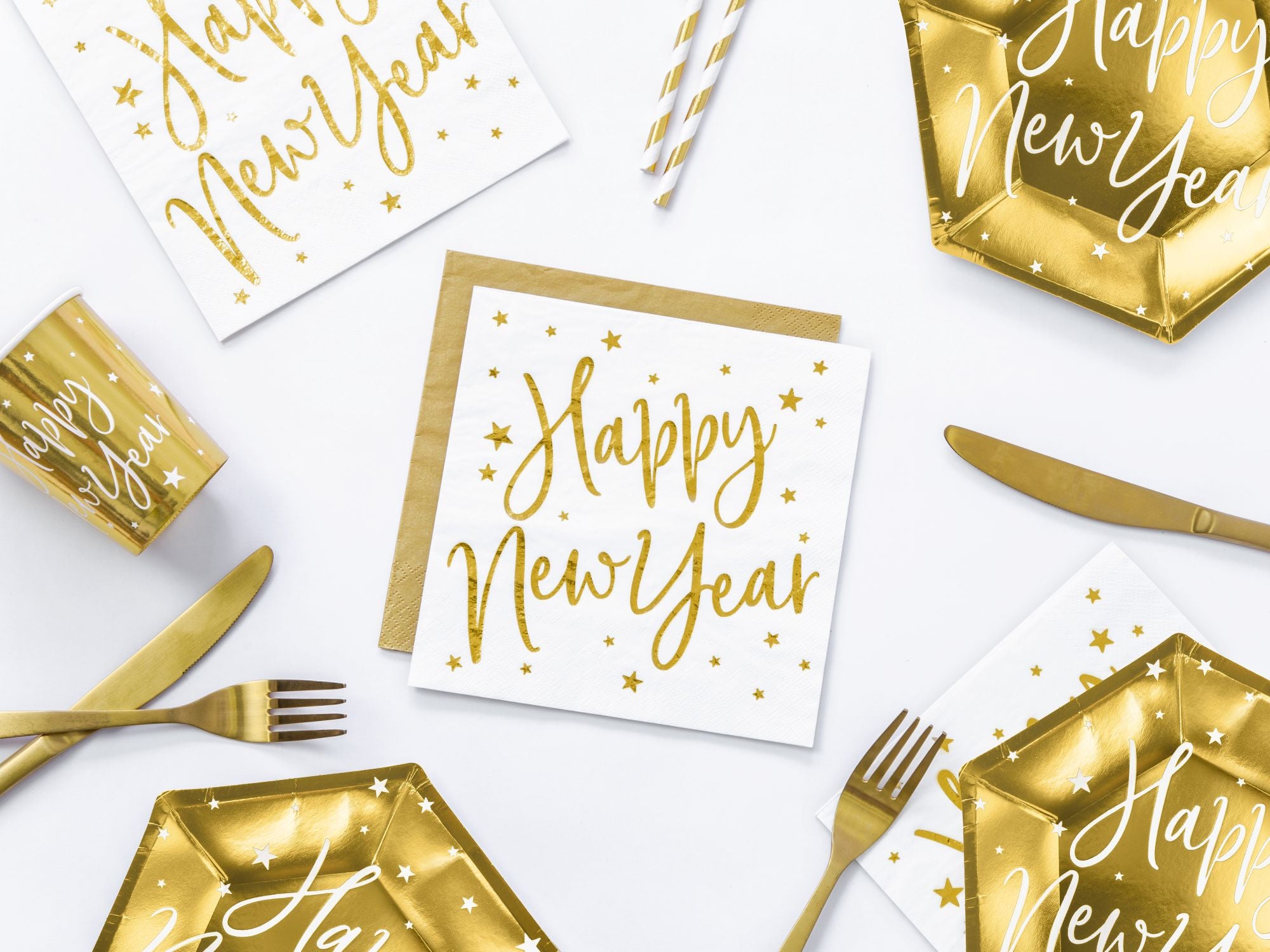 Close up of white Happy New Year napkin with metallic gold foil script and stars