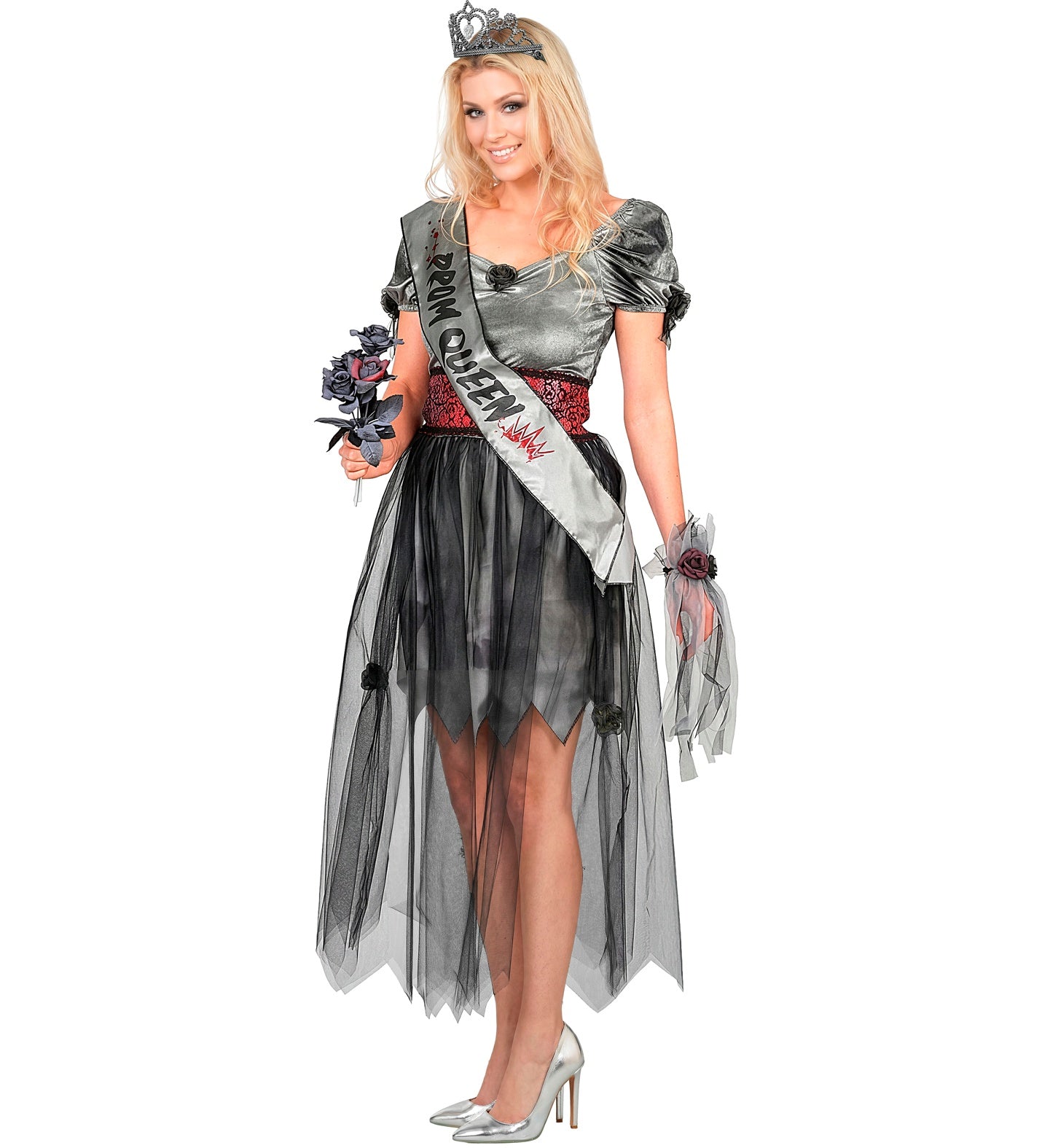 A female model posing in a zombie prom queen Halloween costume holding a bouquet of black roses, wearing a silver-grey dress with a tattered black tulle skirt, a bloody sash, and a skull tiara.