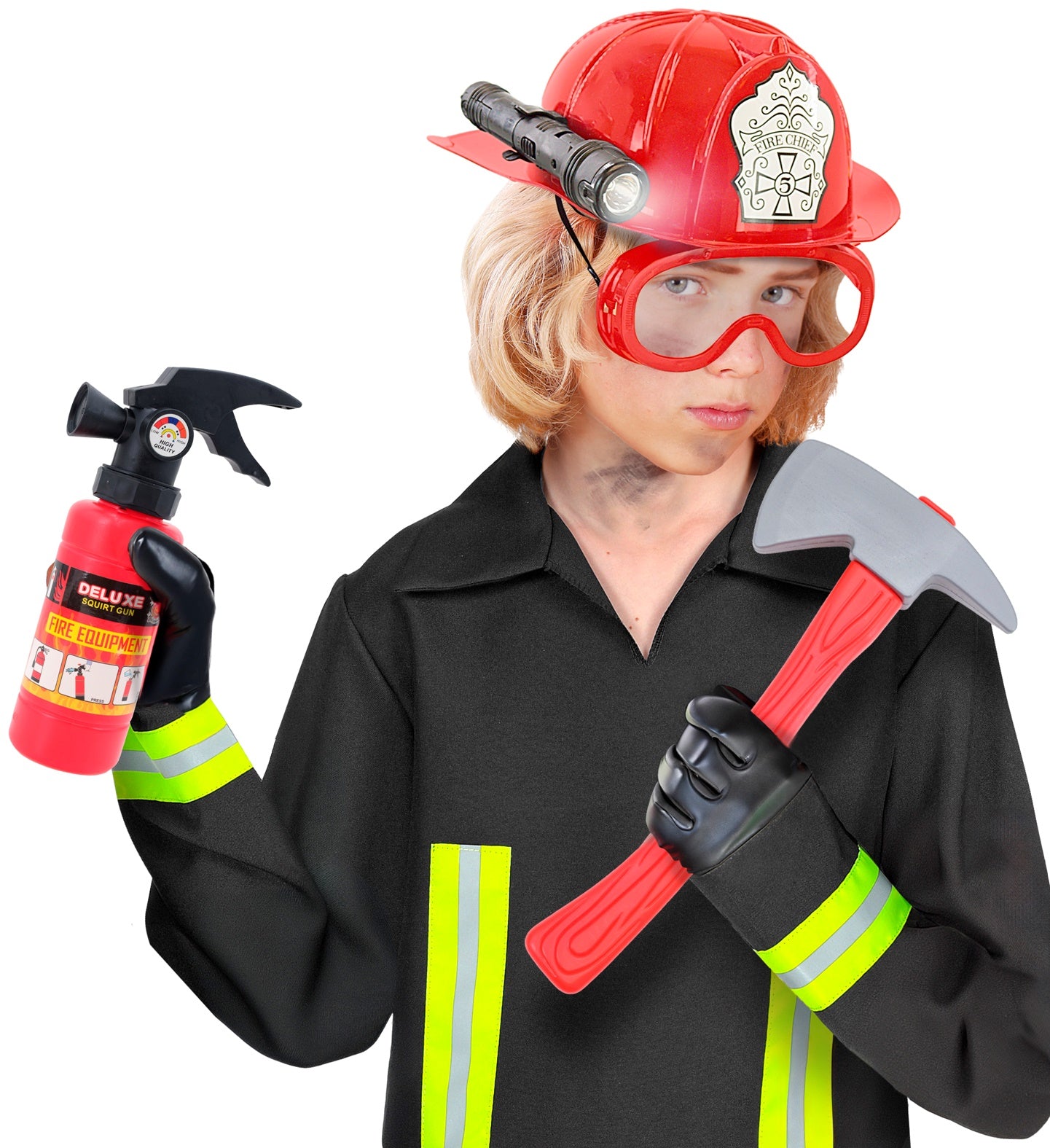 A child wearing a black fireman's jacket with yellow reflective stripes, a red fireman's helmet with an attached flashlight and clear goggles, holding a red toy axe in one hand and a red toy fire extinguisher (squirt gun) in the other, ready for imaginative play.