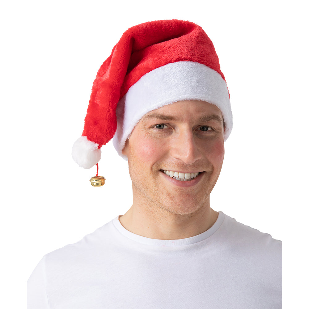 A close-up of a man smiling while wearing the deluxe red and white Santa hat with an audible jingle bell.