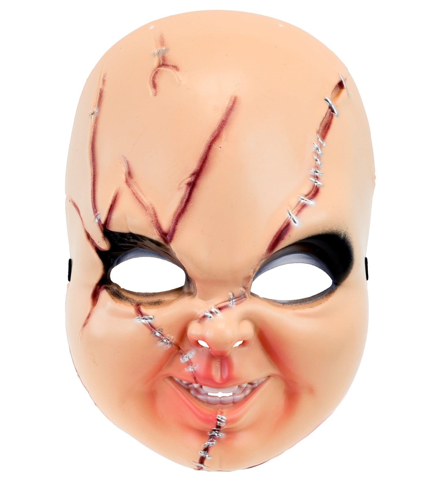 A straight-on flat lay view of a bald, hard plastic killer doll mask featuring rosy cheeks, a creepy smile with teeth, dark eye shading, and realistic molded scars with silver painted stitches.