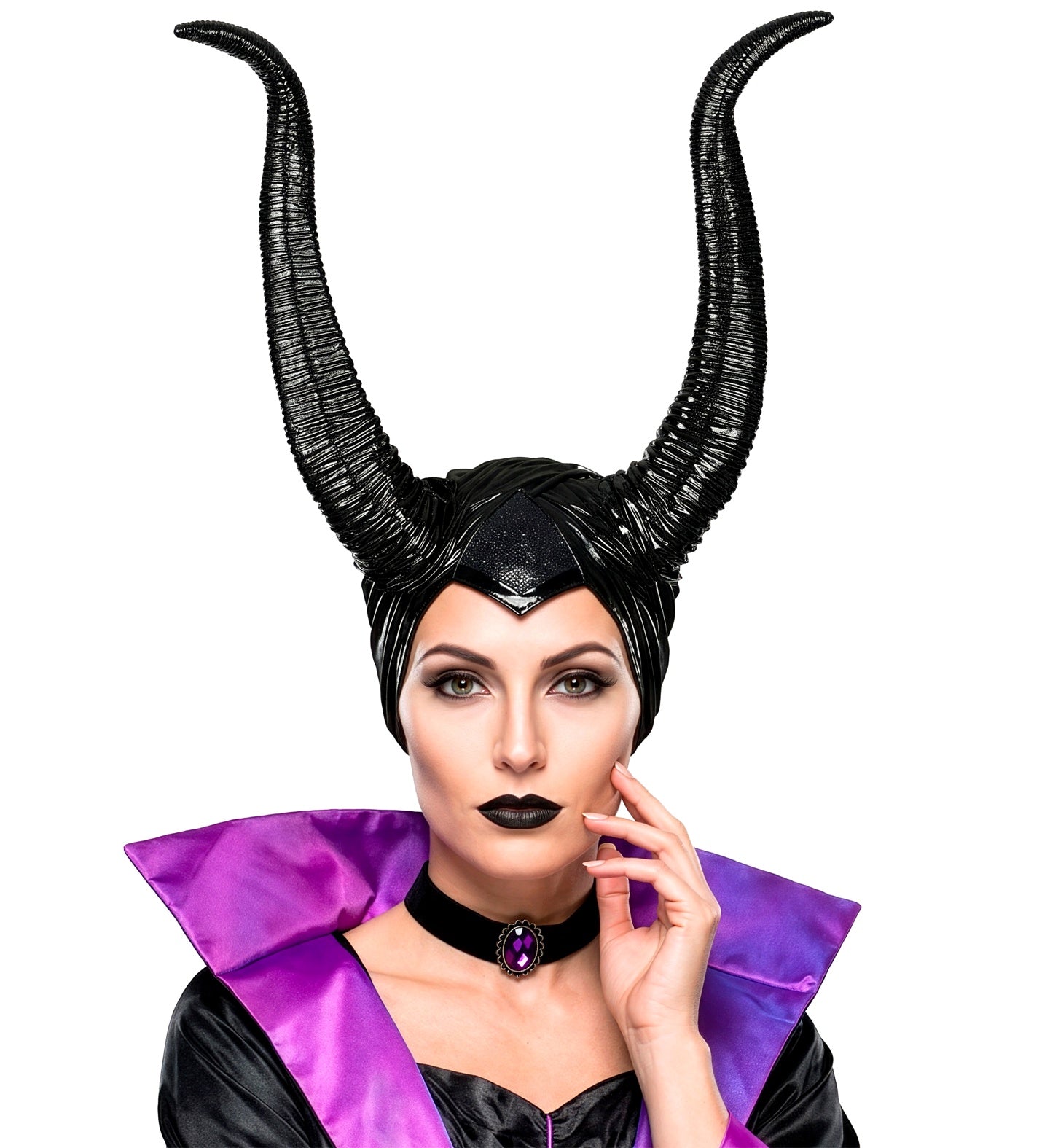 A model wearing a glossy black dark fairy headpiece with tall curved horns, styled with striking dark makeup, a black choker with a purple gem, and a high-collared purple and black villain cape.