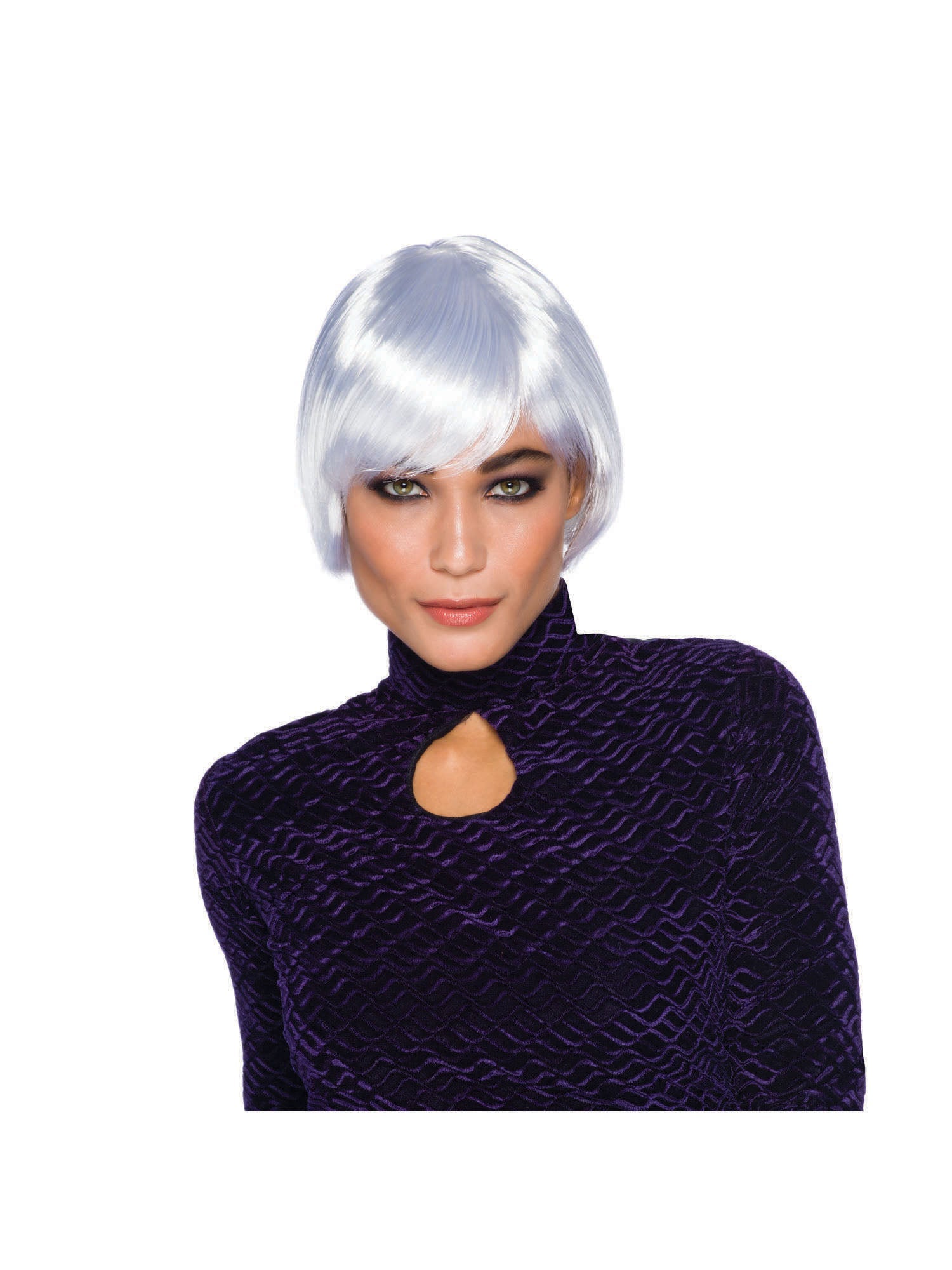 A lady with a short, white, layered wig, wearing a dark purple velvet top with a cutout at the neck, looking at the camera.