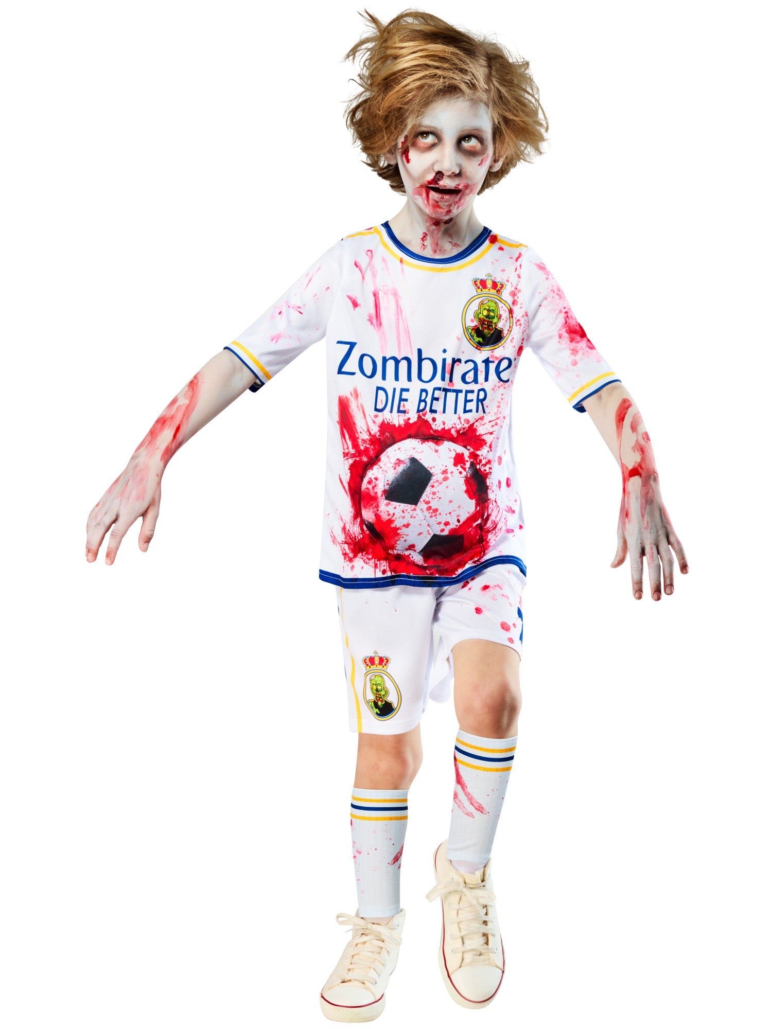 A child in a zombie football costume, posing in a running or lunging motion, with arms and hands outstretched. The costume features a white top with red splatters, a padded football sticking out of the belly, and a wild-haired, zombie-like face.