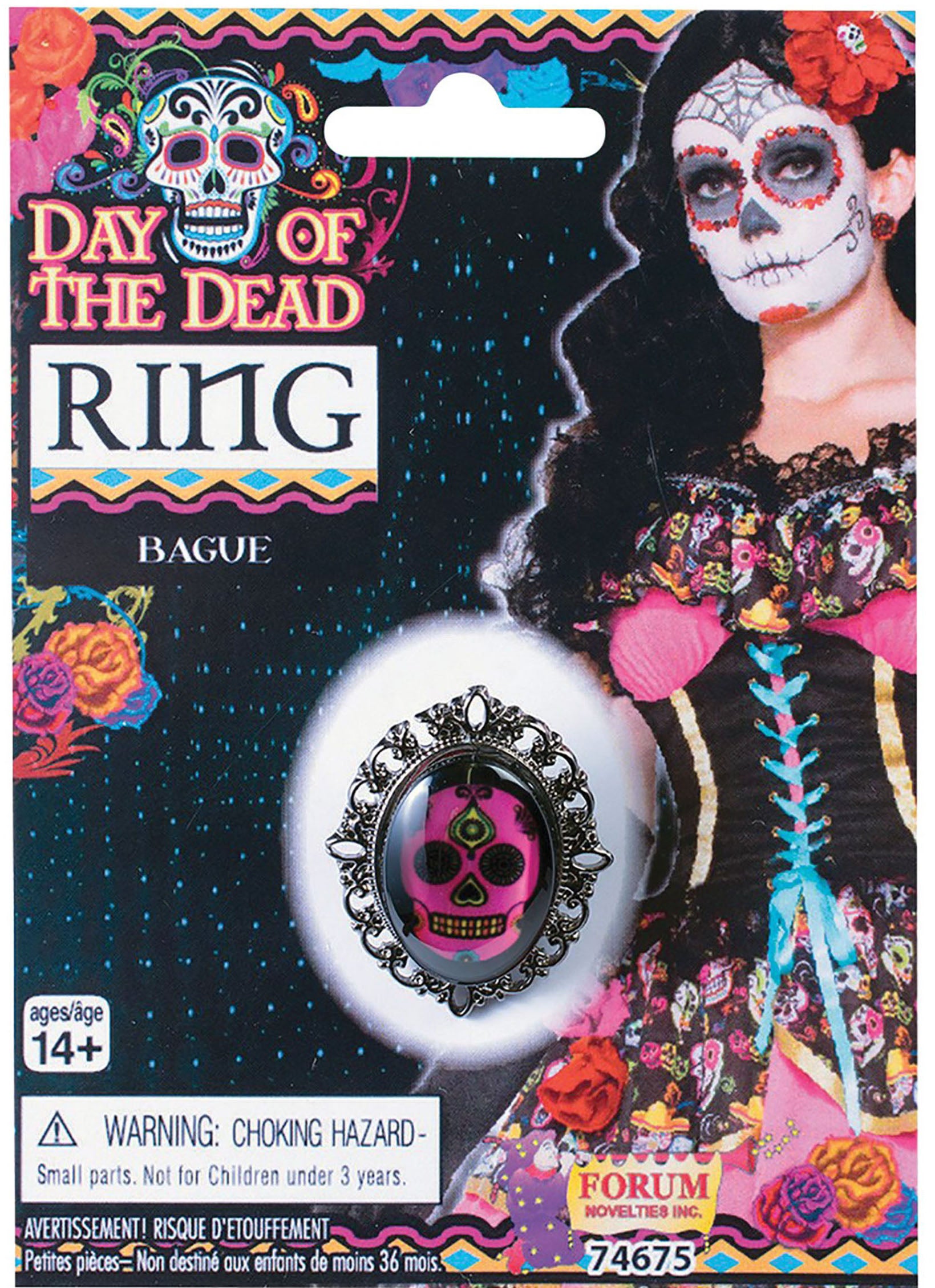 Packaging of a Day of the Dead sugar skull ring with a pink skull surrounded by silver detailing, displayed on a card with Day of the Dead themed graphics.
