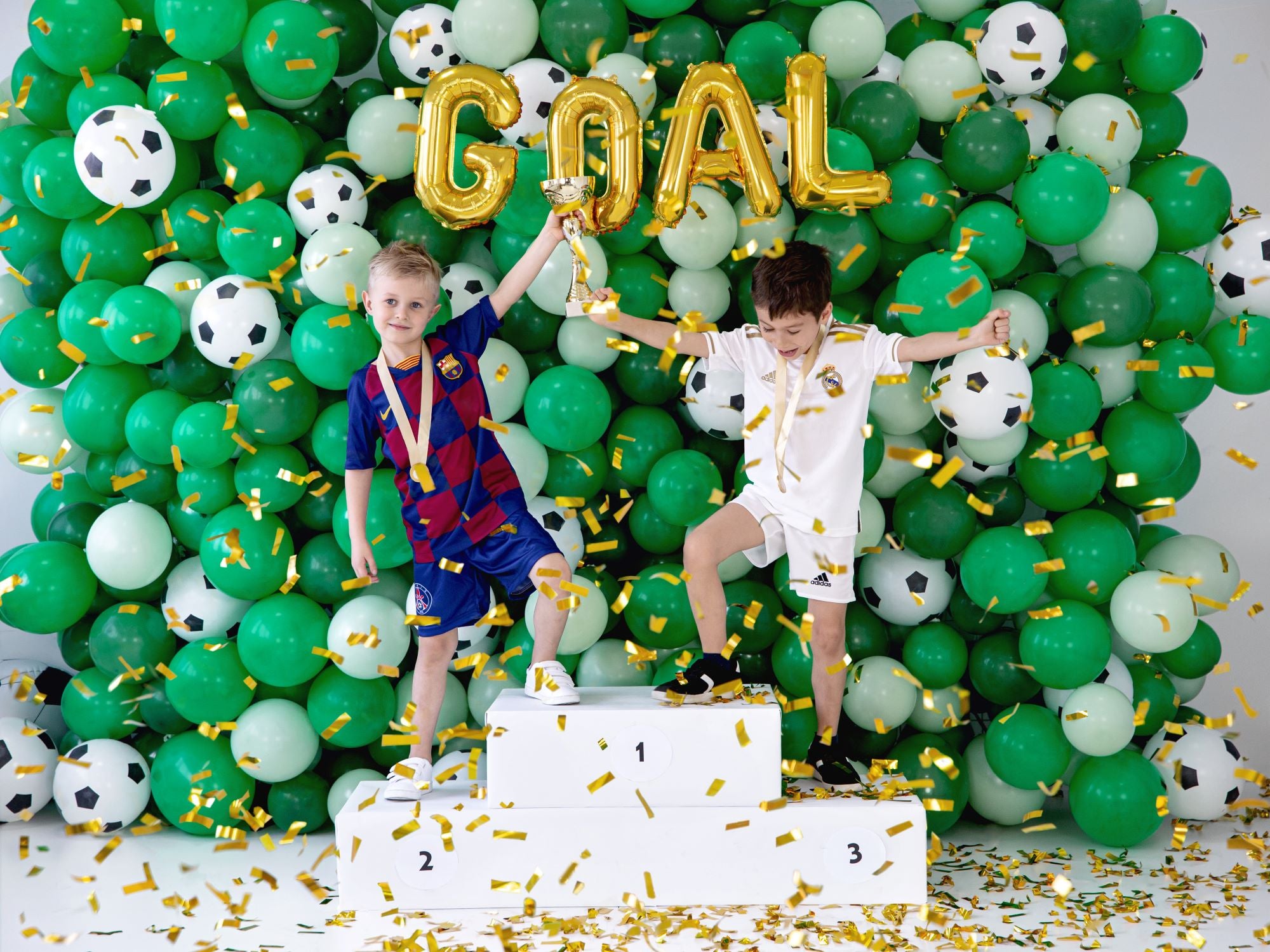 Kids at soccer birthday party with Football Balloons