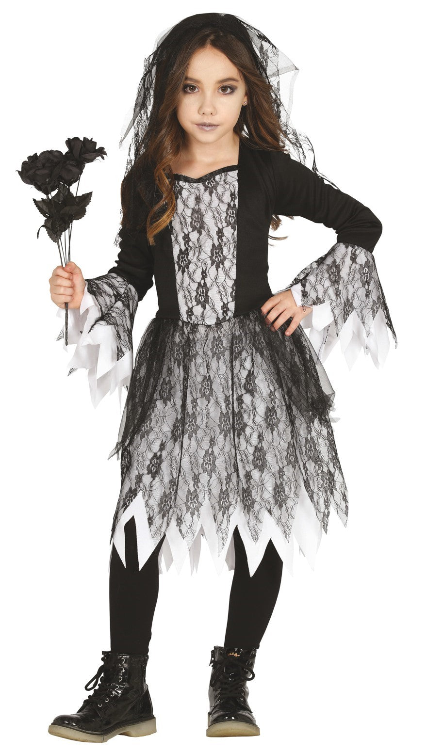 Child in a Ghost Bride Costume with a long black and white designed dress and a matching headpiece, holding a black rose.