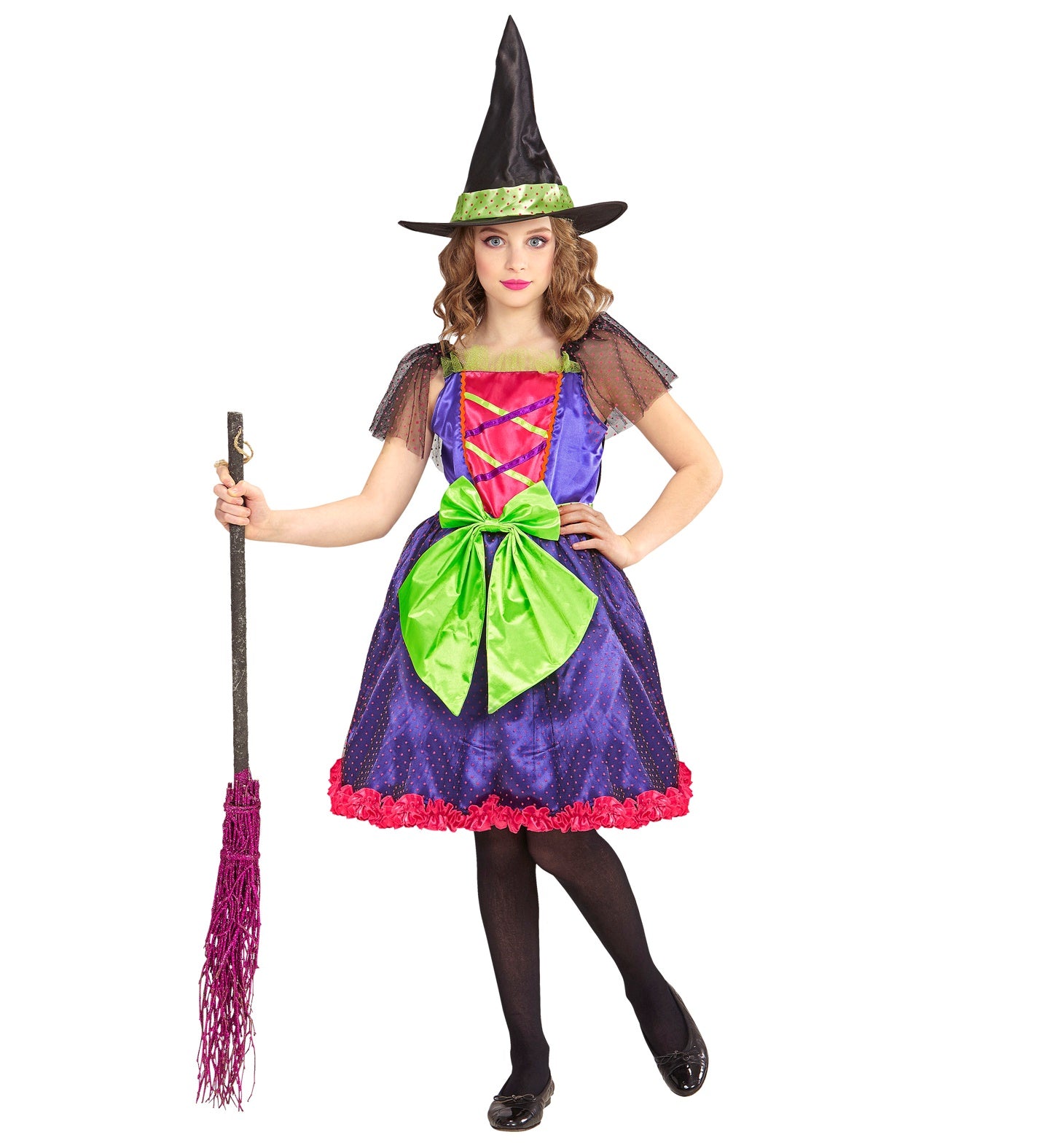 A child in a Glamour Witch costume with a pink and purple dress, black hat, and green bow, holding a broom.