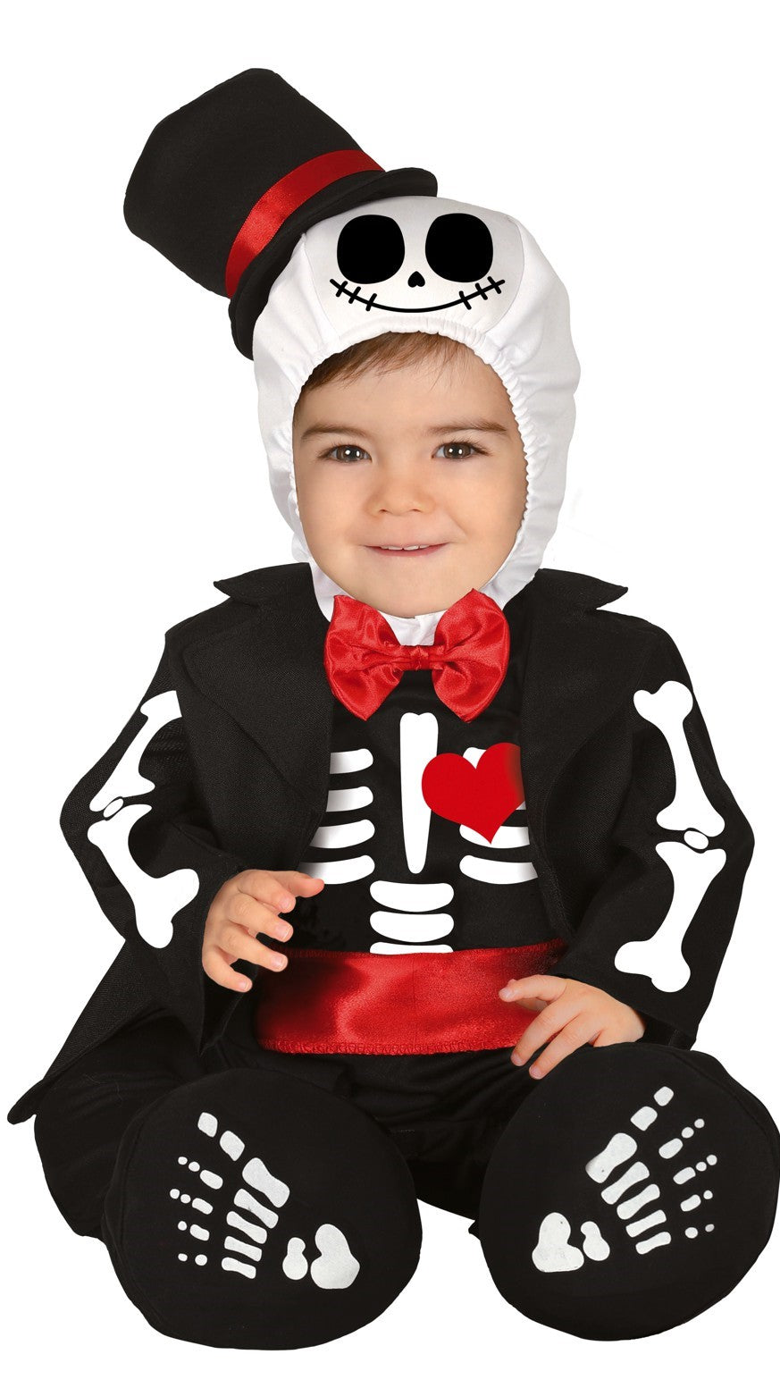 A toddler in a Mister Skeleton costume, featuring a black and white bone-patterned jumpsuit, a red bow tie, white hood with a skull design, and matching booties.