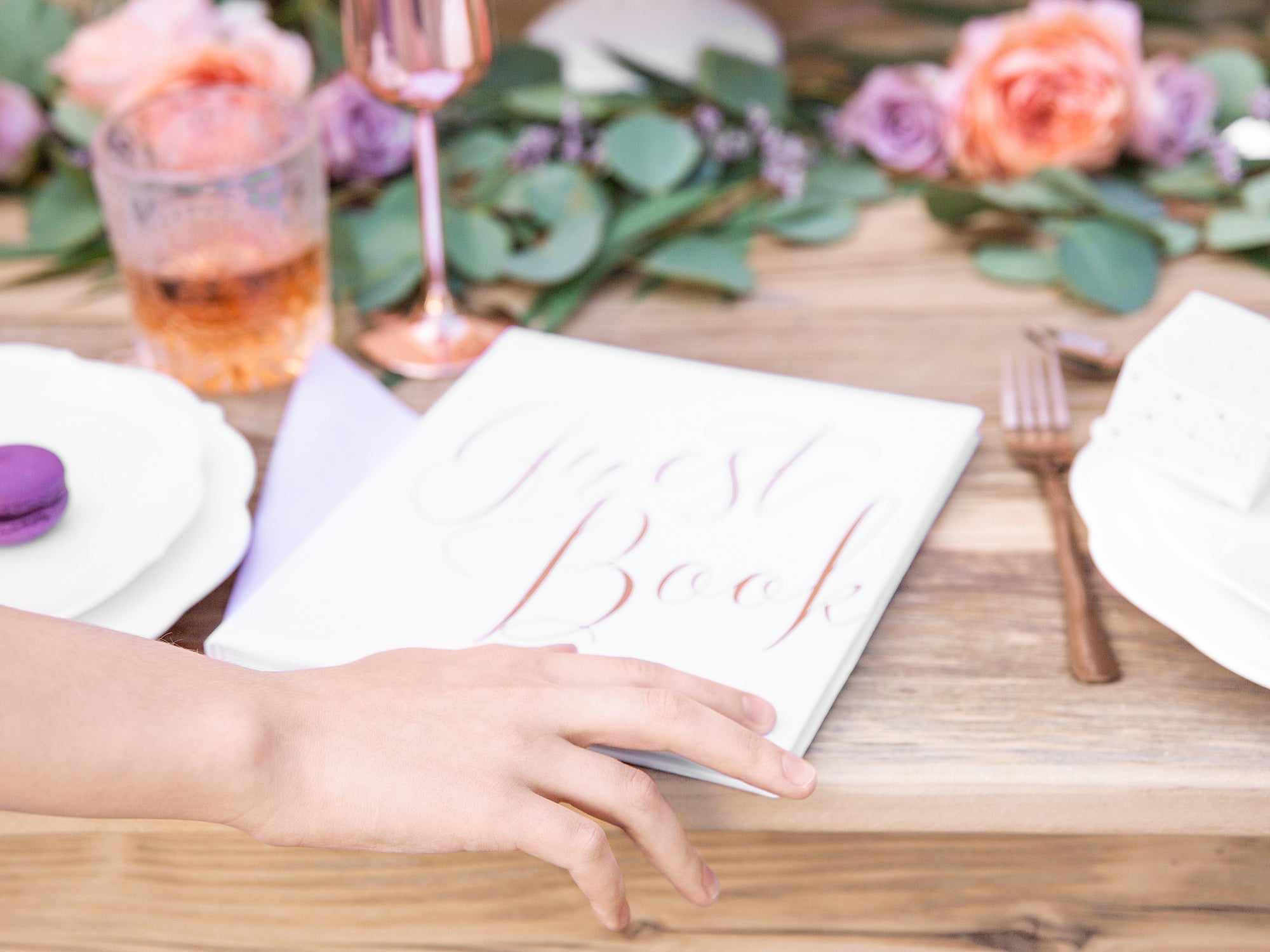White & Rose Gold Guest Book on table