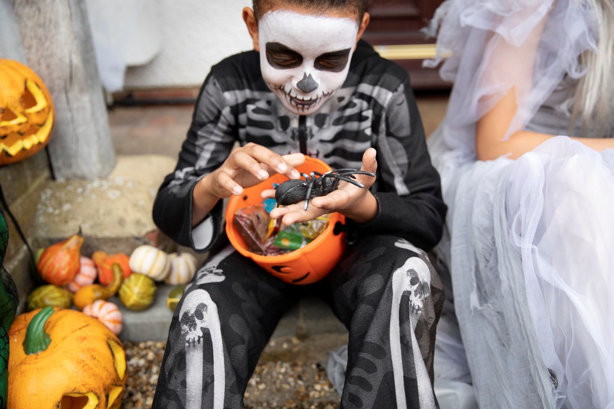 Childr dressed in a skeleton costume