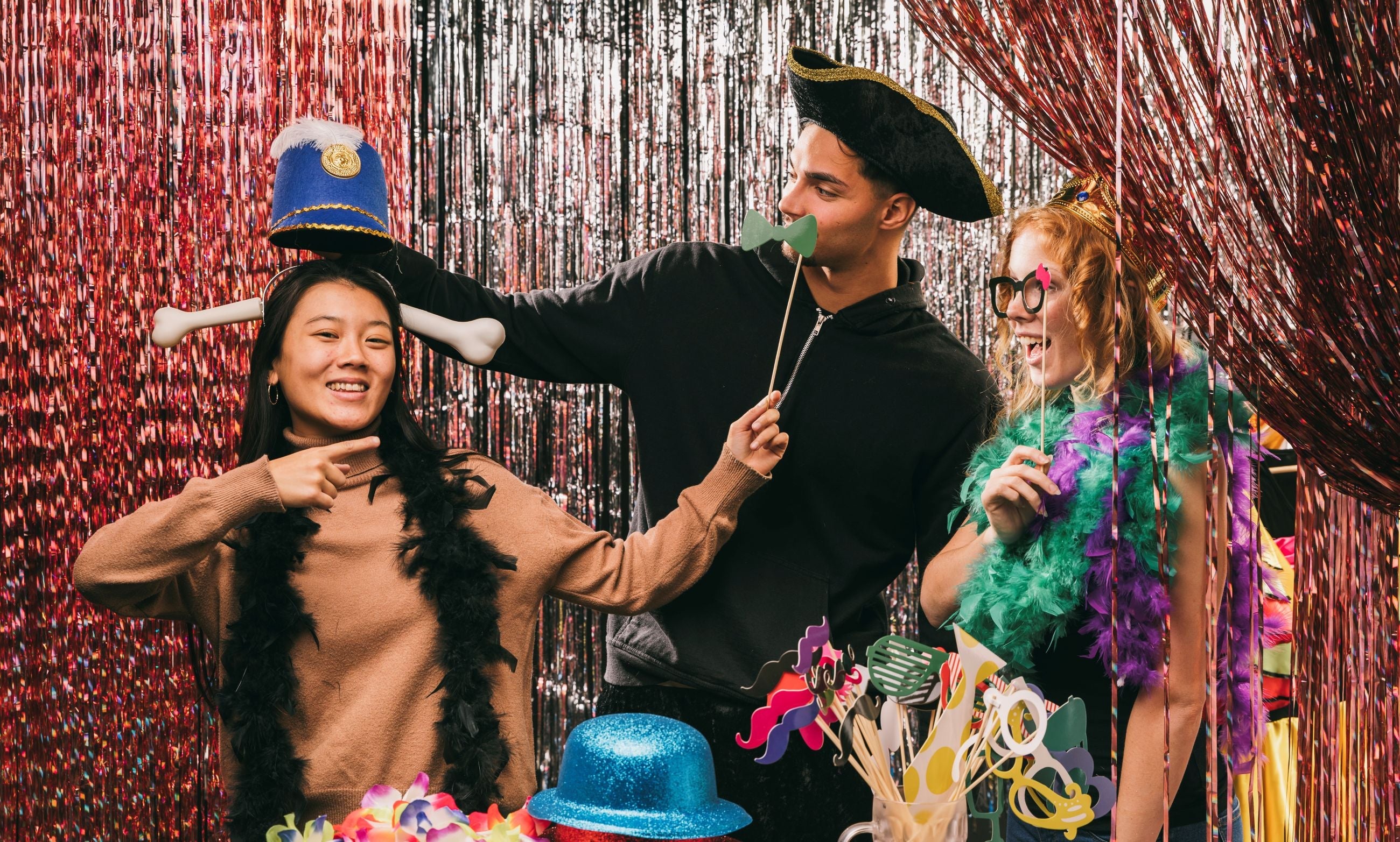 Group of peoplewearing fancy dress accessories